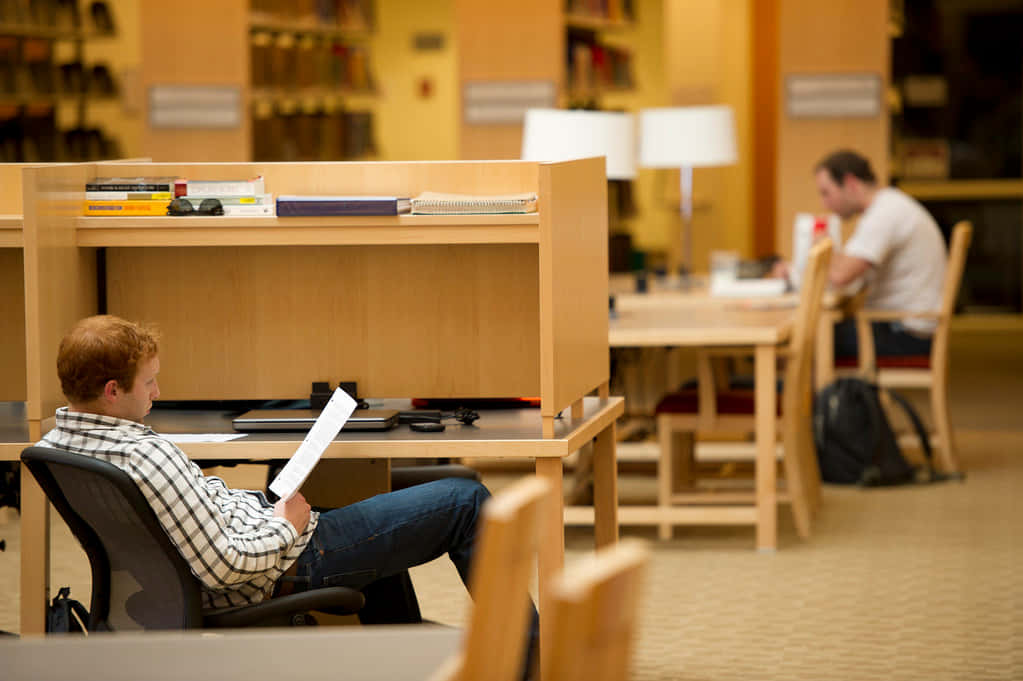 plaid shirt, wooden study carrel, warmly lit library, SD Desktop Wallpaper