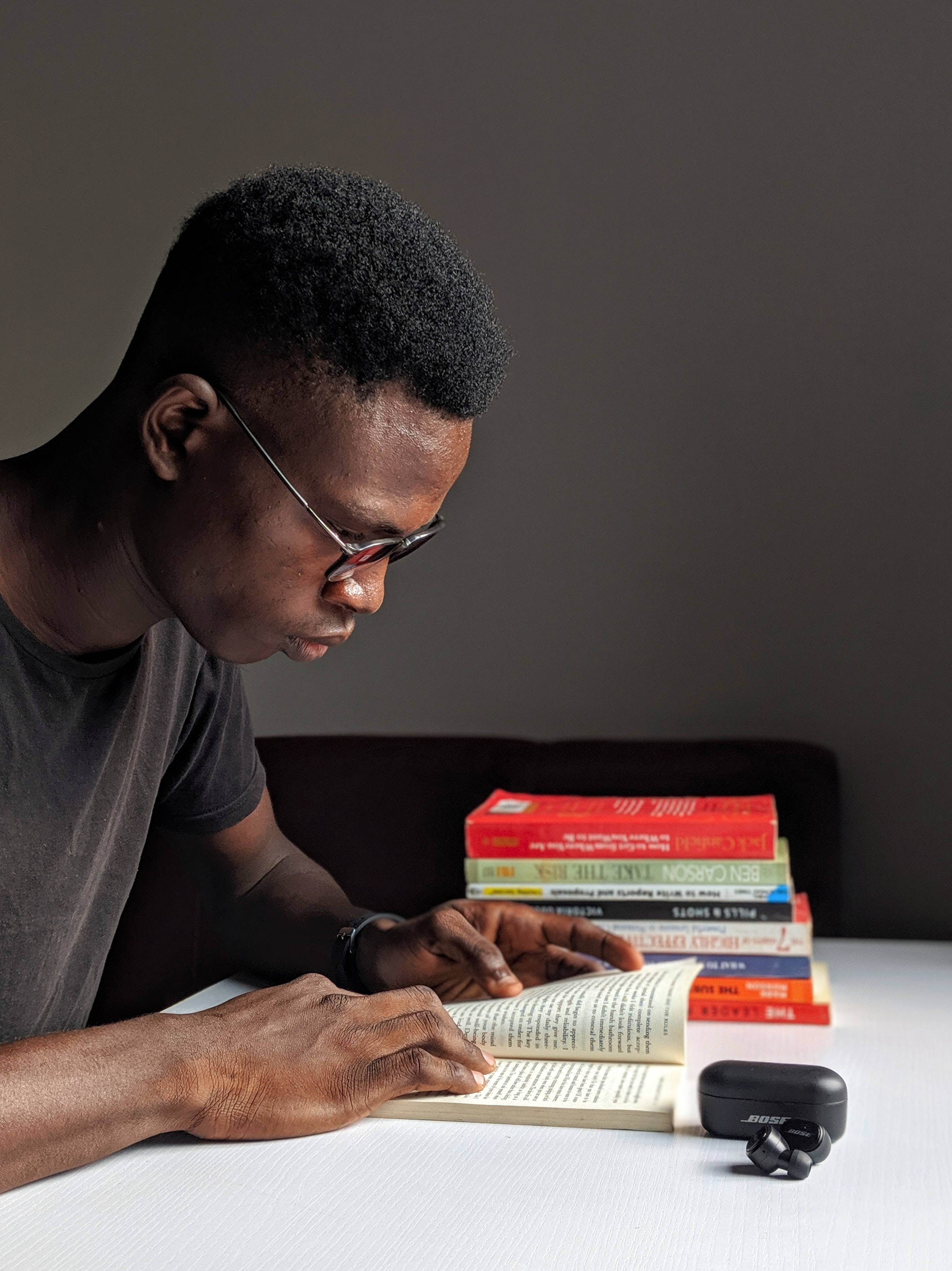 Solo Study Session, young man with glasses, white table, 2K Phone Wallpaper