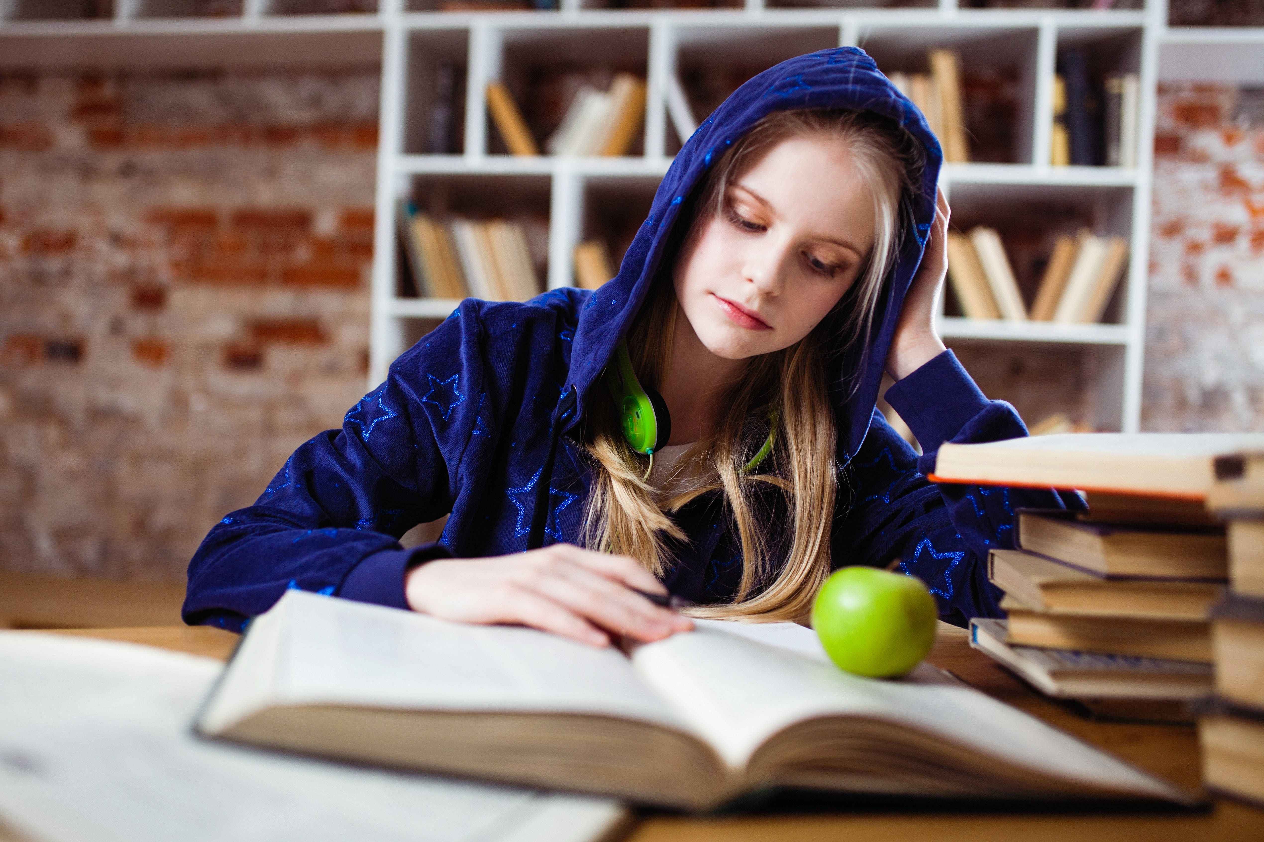 blue hoodie, wooden desk, books, 4K Desktop Wallpaper