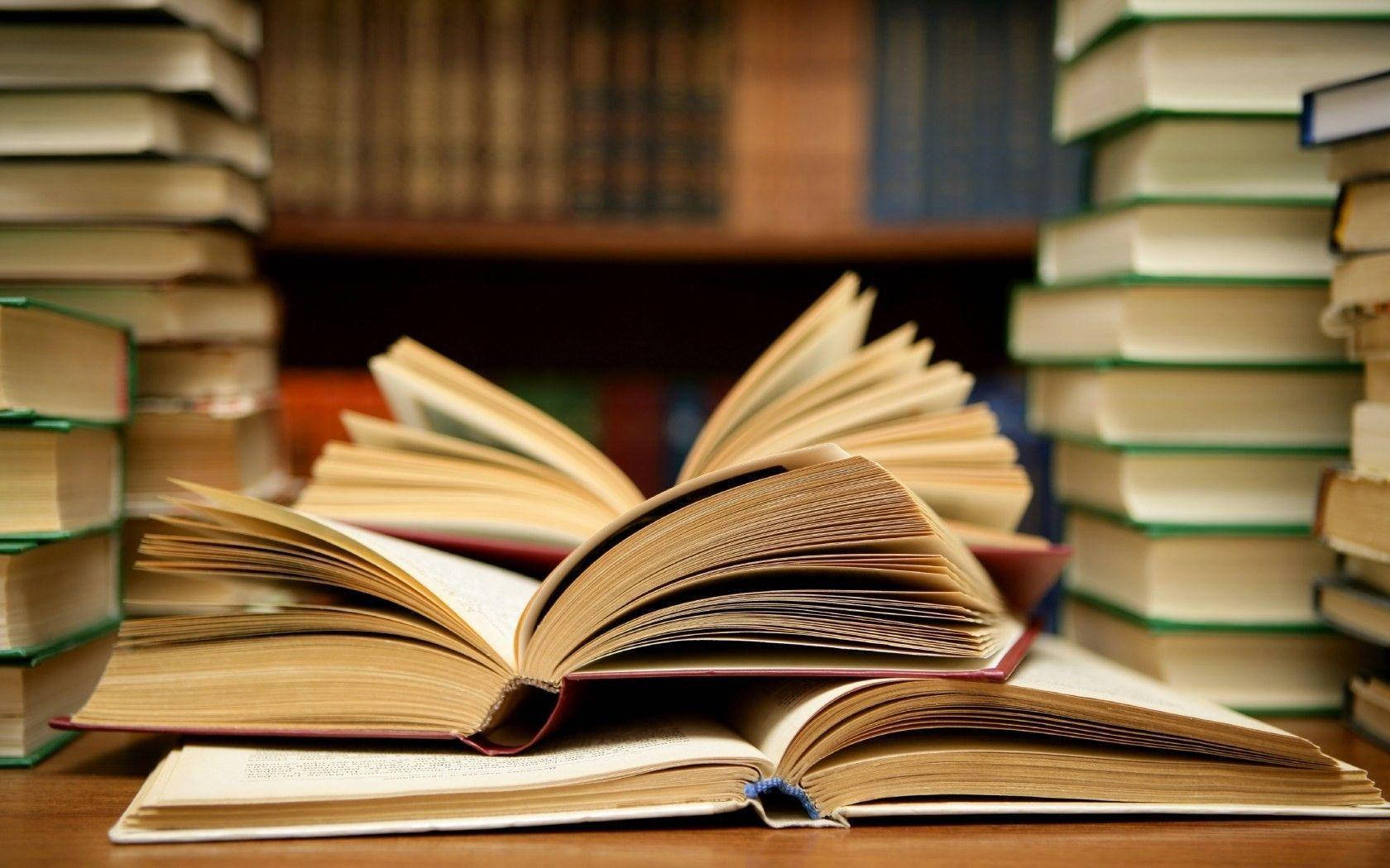 open book, wooden table, towering stacks of books, HD Desktop Wallpaper