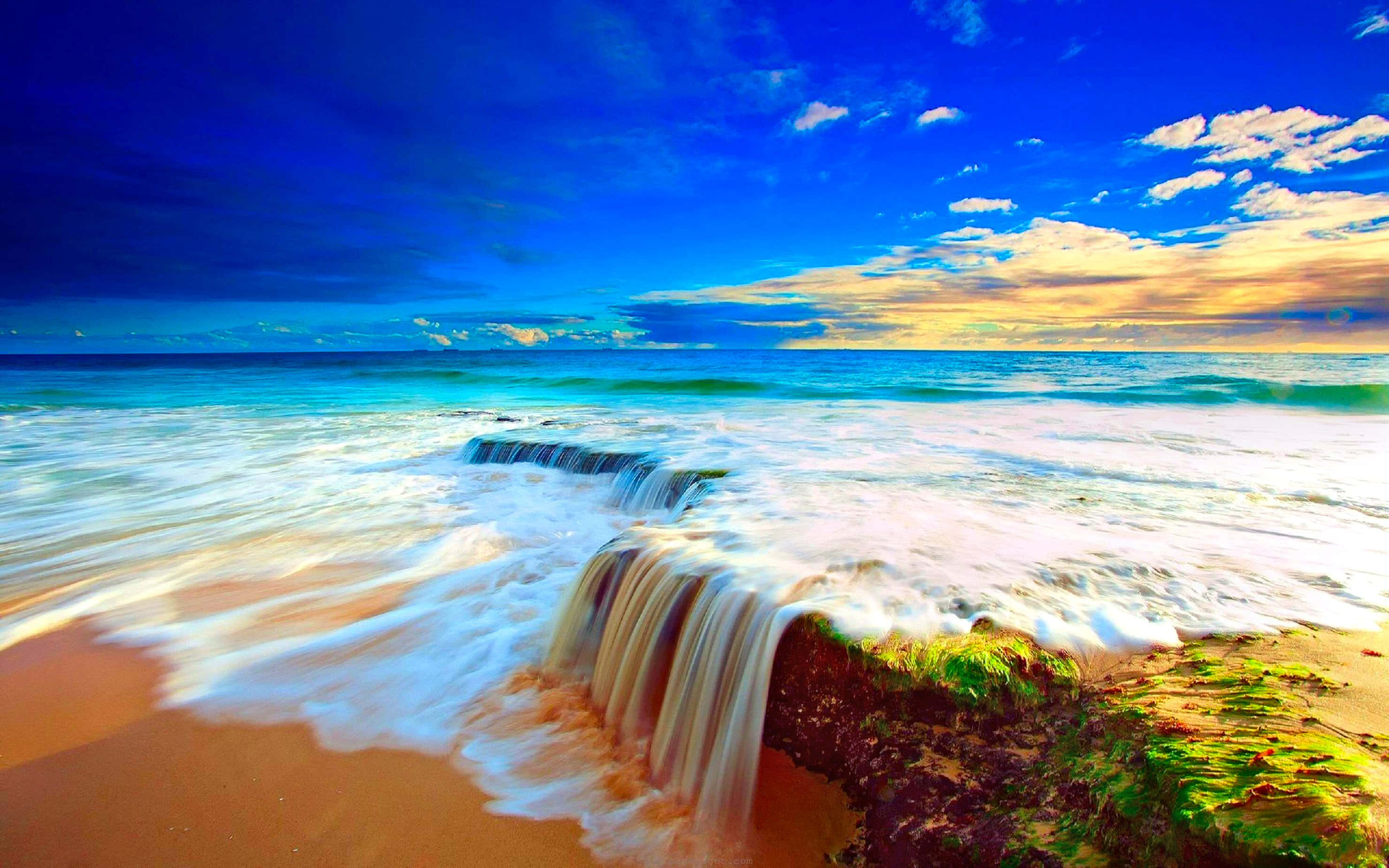 ocean waves, rocky ledge, golden sand, 2K Desktop Wallpaper