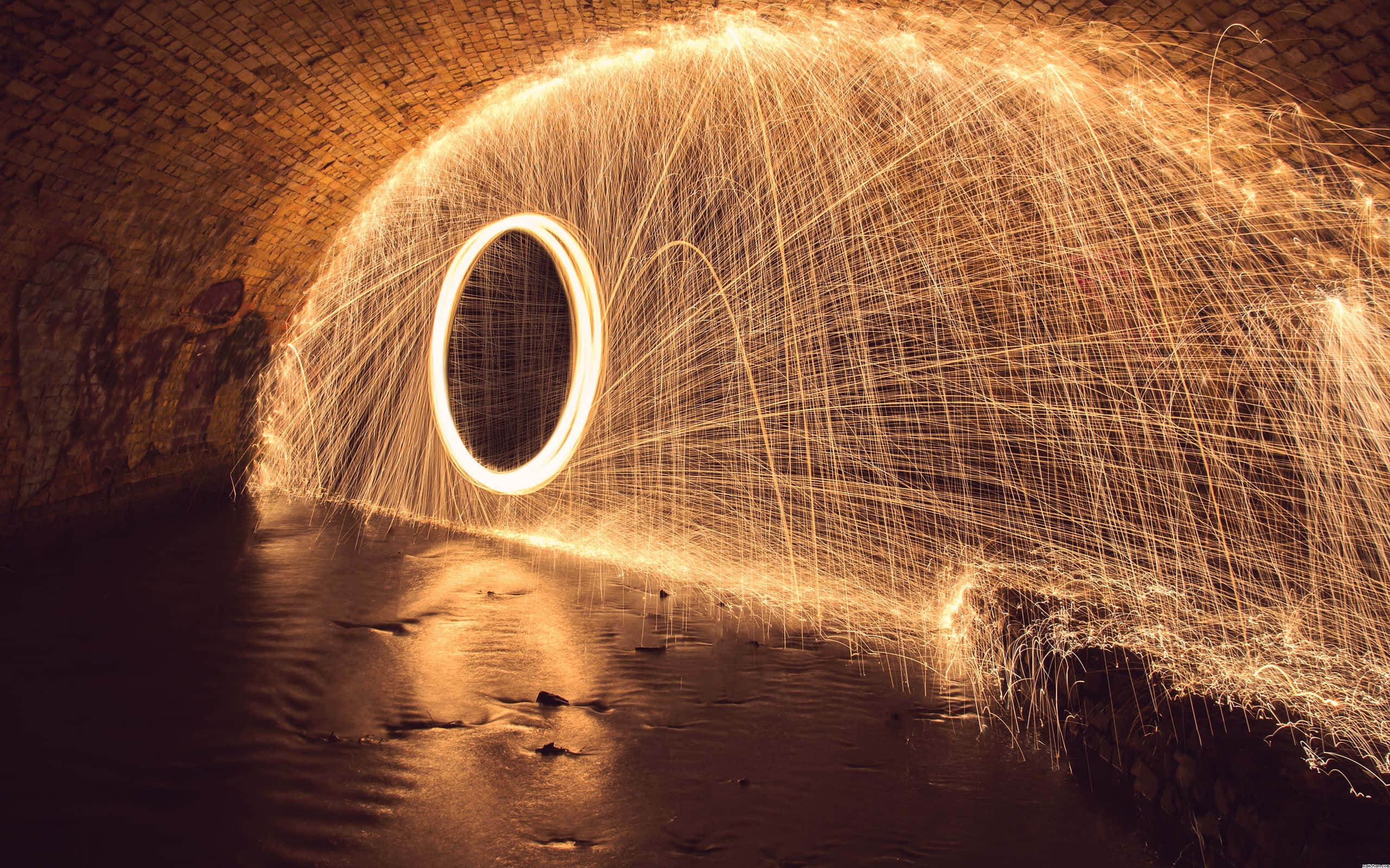 orange light sparks, golden steel wool sparks, glowing circular motion, 2K Desktop Wallpaper
