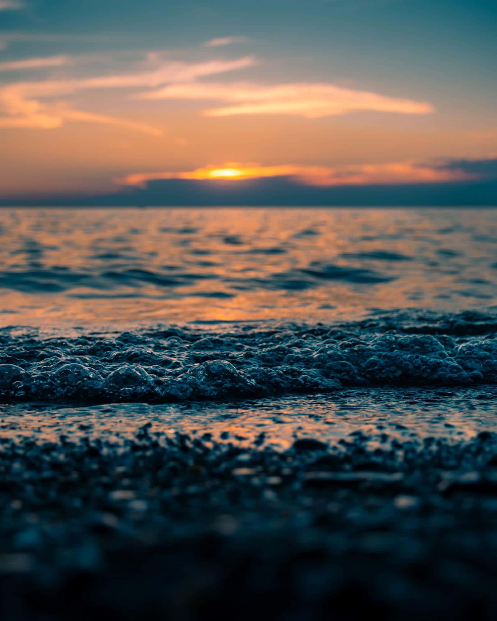 Sunset, warm orange and pink hues, gentle waves, Full HD Phone Wallpaper
