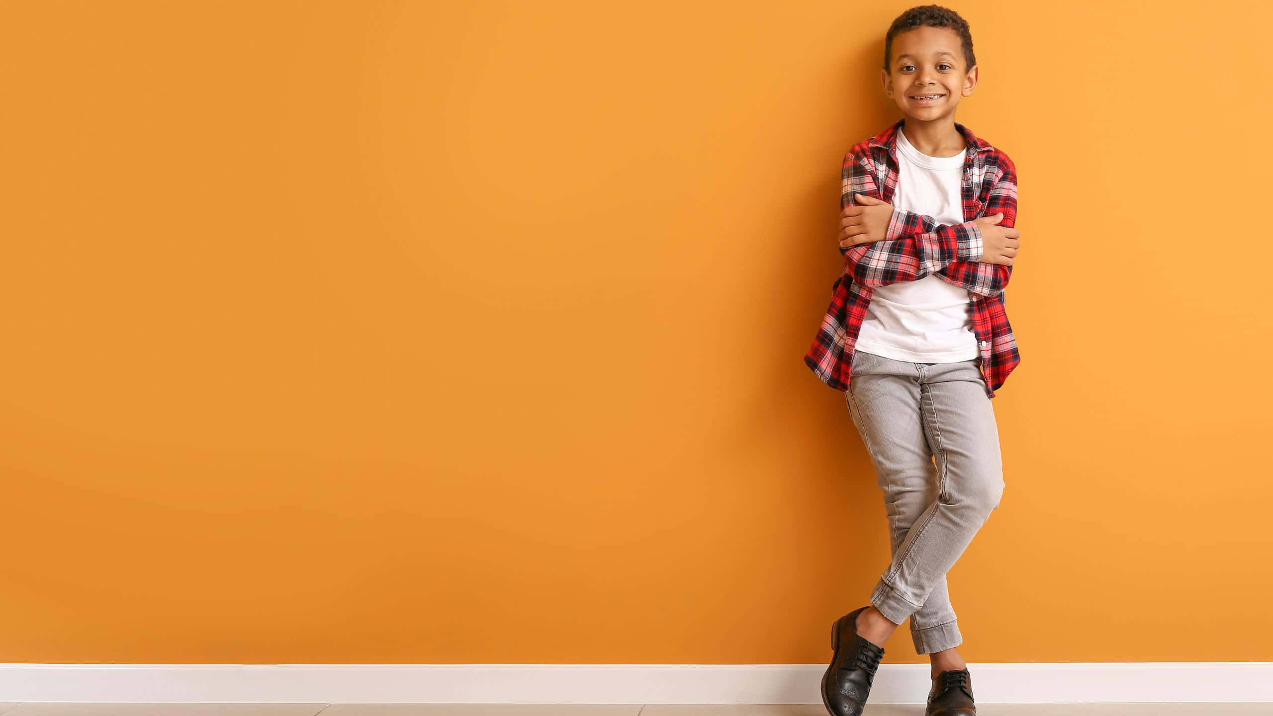 Stylish Boy, red plaid shirt, vibrant orange wall, 2K Desktop Wallpaper