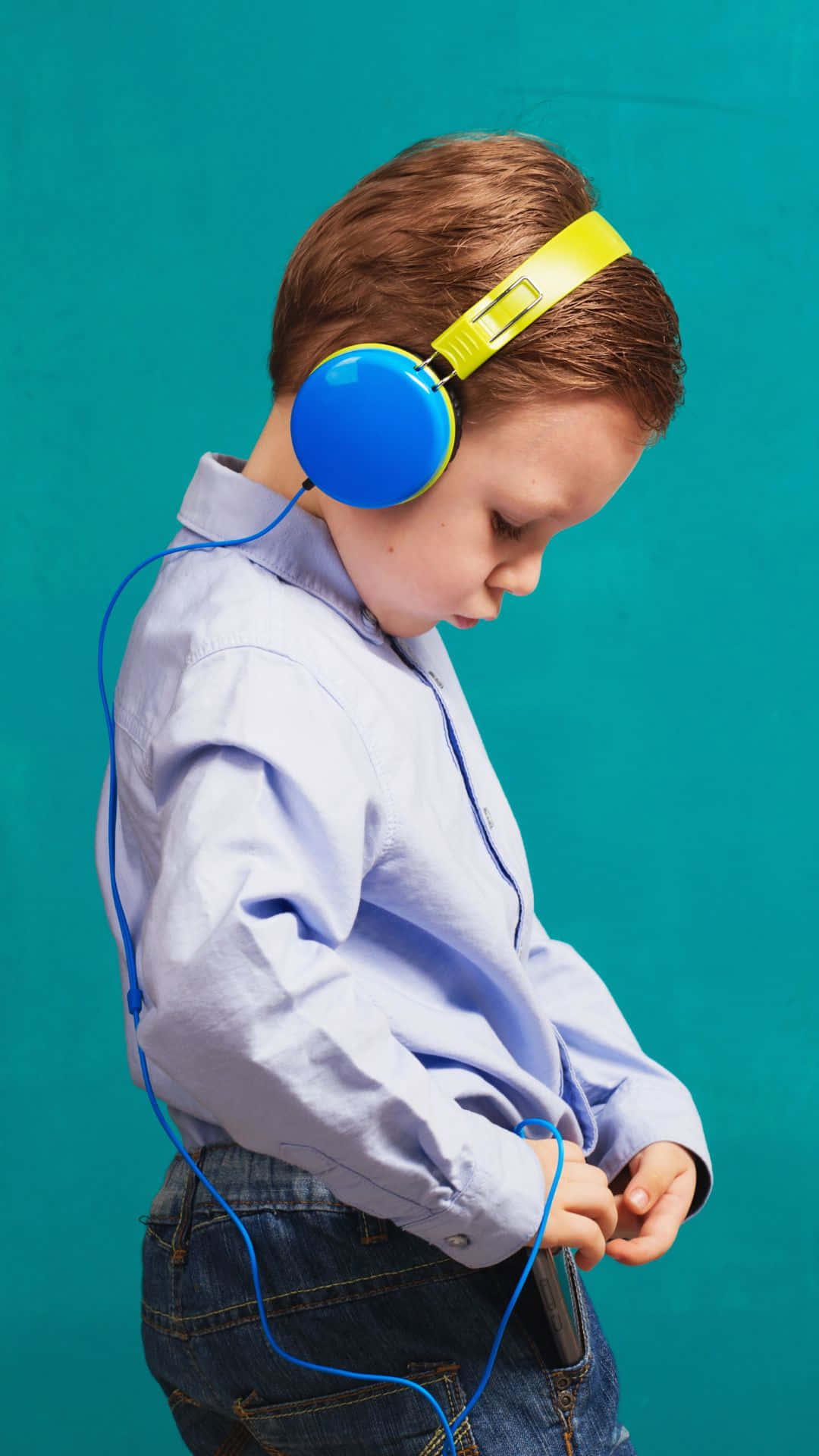 light blue shirt, jeans, bright blue and yellow headphones, Full HD Phone Wallpaper