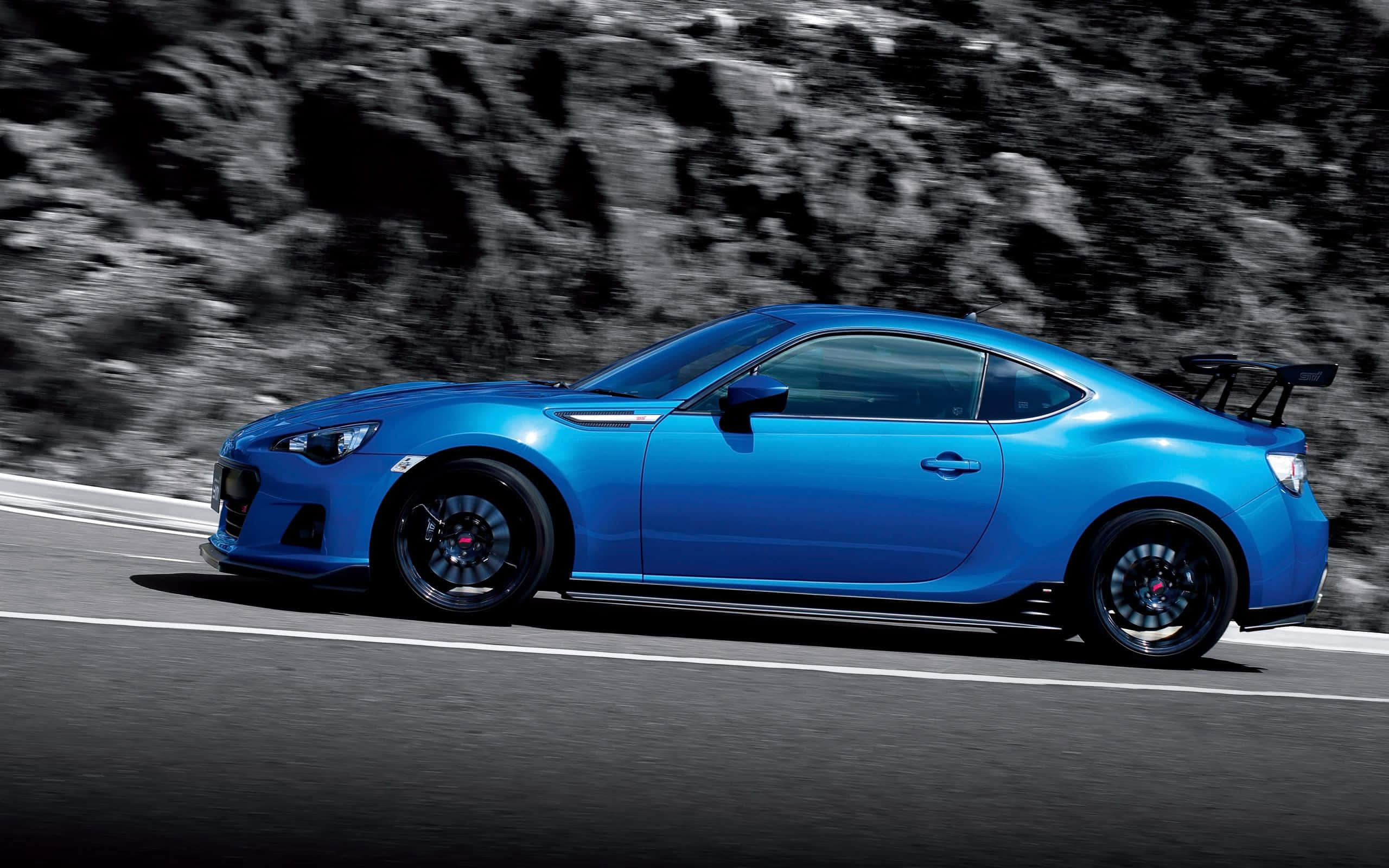 Subaru BRZ, vibrant blue, winding mountain road, 2K Desktop Wallpaper