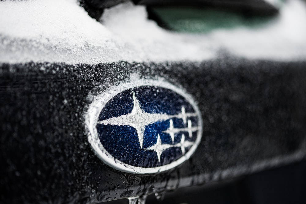 Subaru logo, snow, dark car hood, SD Desktop Wallpaper