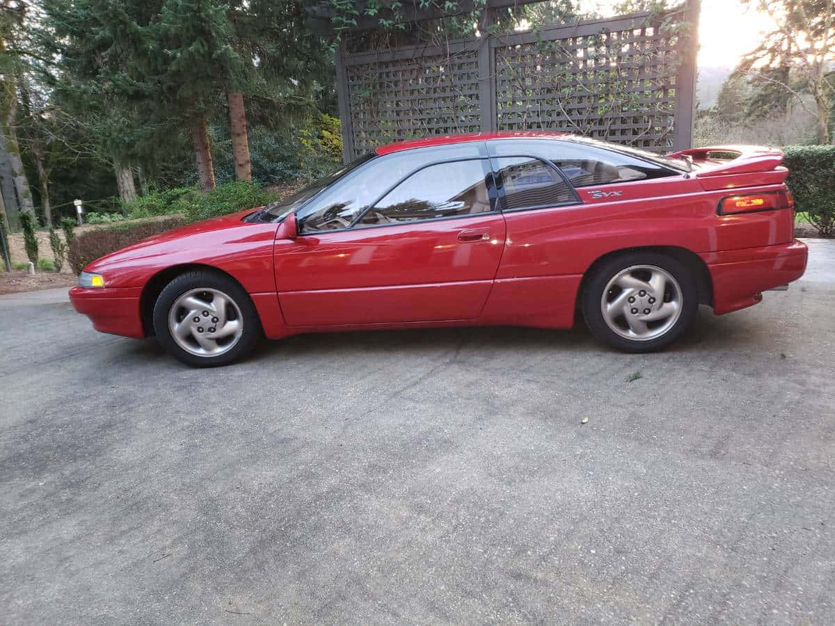 Subaru SVX, vibrant red, concrete driveway, SD Desktop Wallpaper
