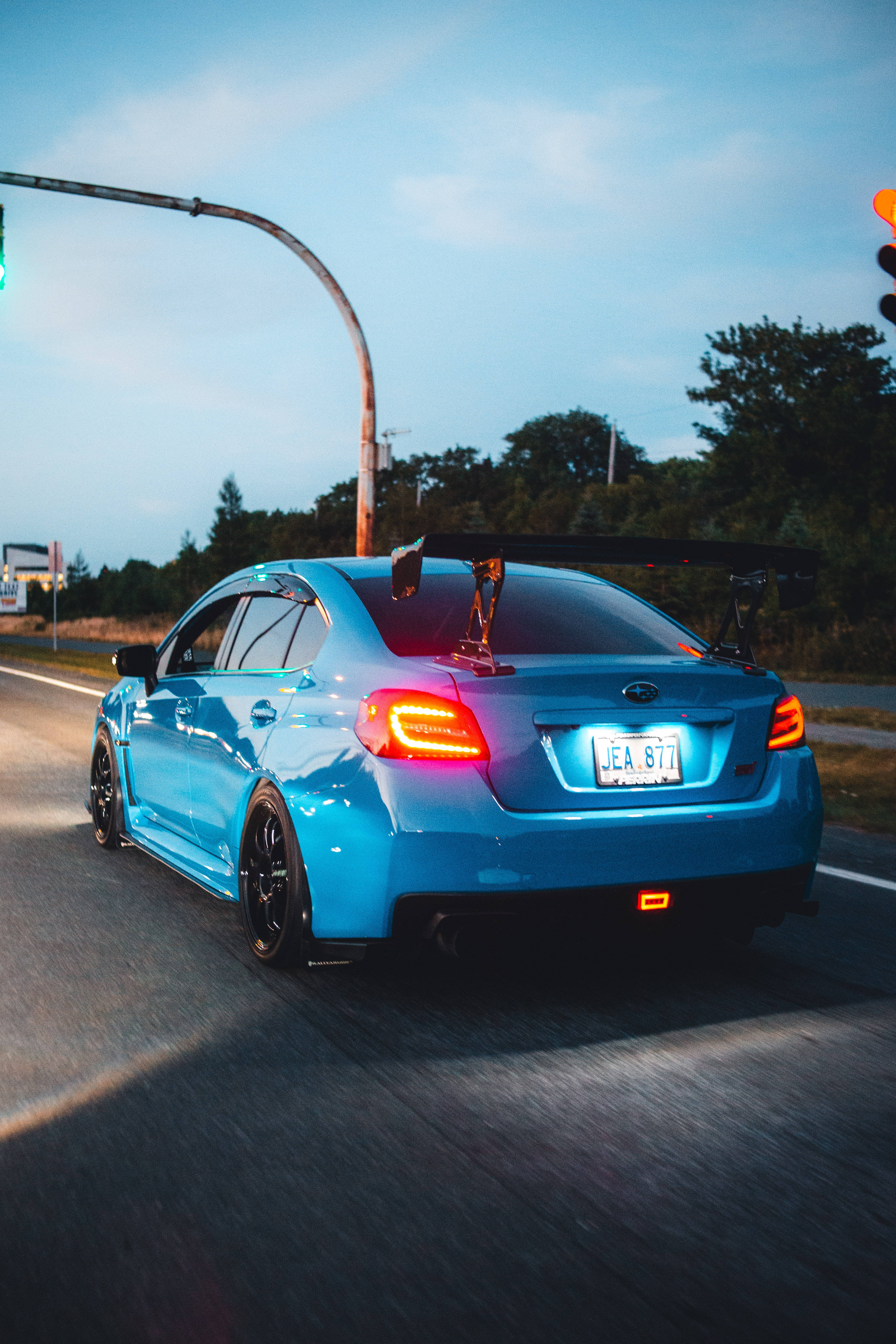 Subaru WRX STI, vibrant blue, large rear wing, 4K Phone Wallpaper