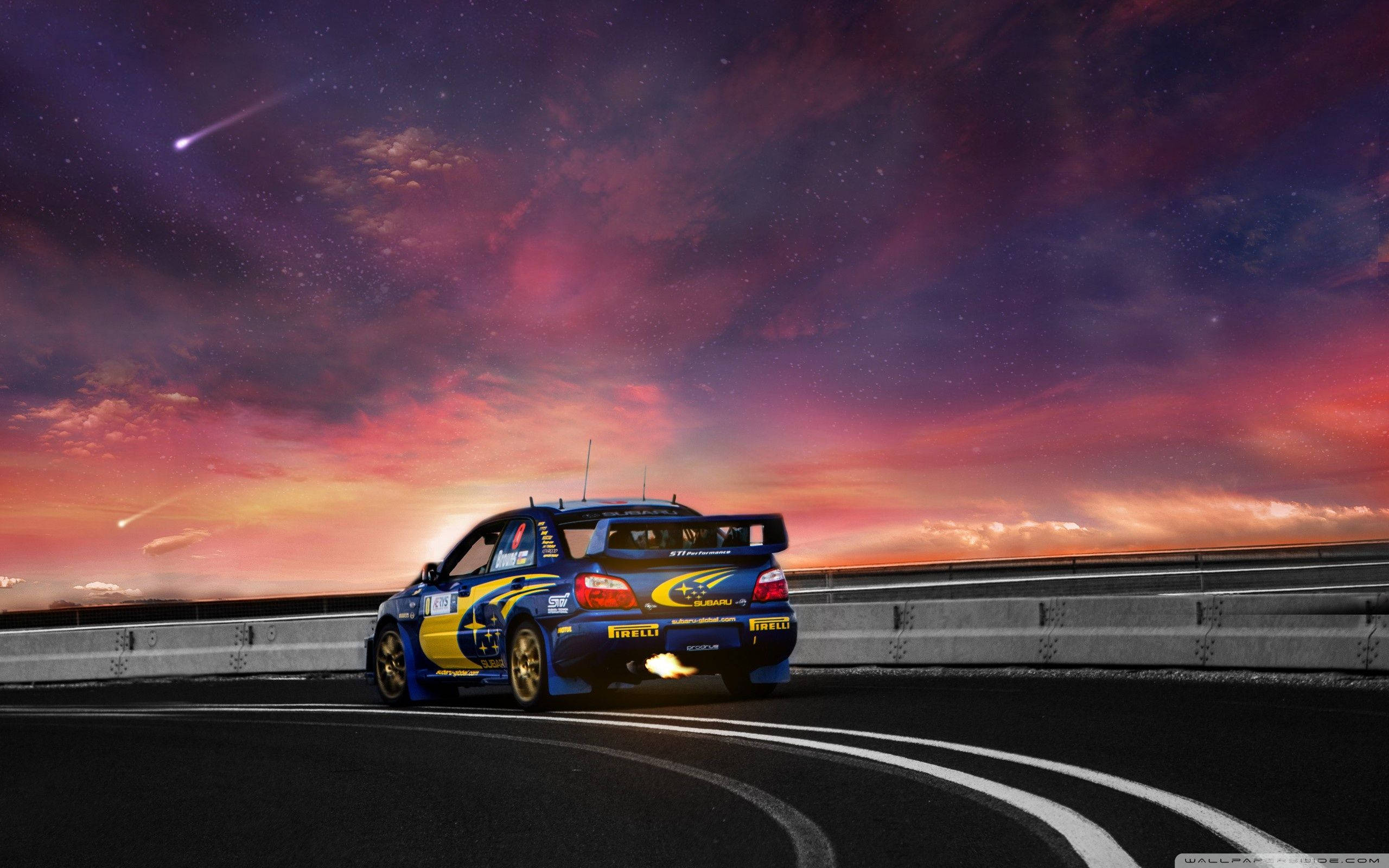 Subaru WRX, blue and yellow rally car, winding road, 2K Desktop Wallpaper