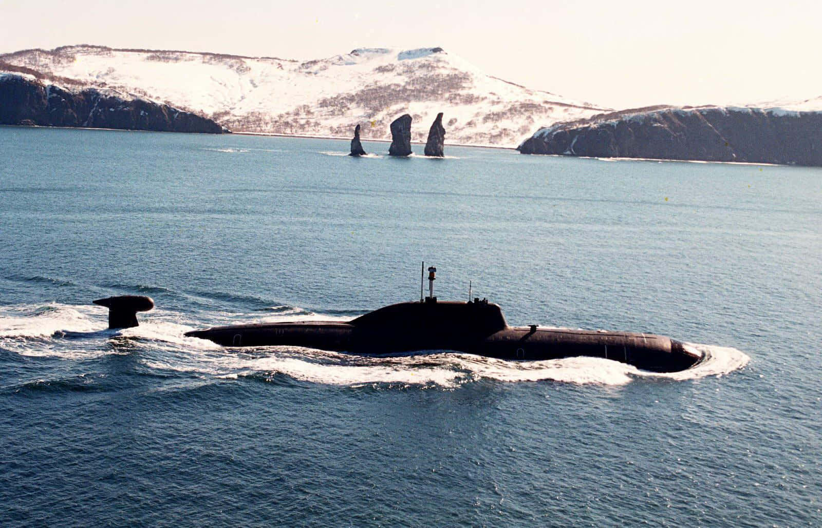 modern submarine, calm blue waters, snow-capped rocky islands, HD Desktop Wallpaper