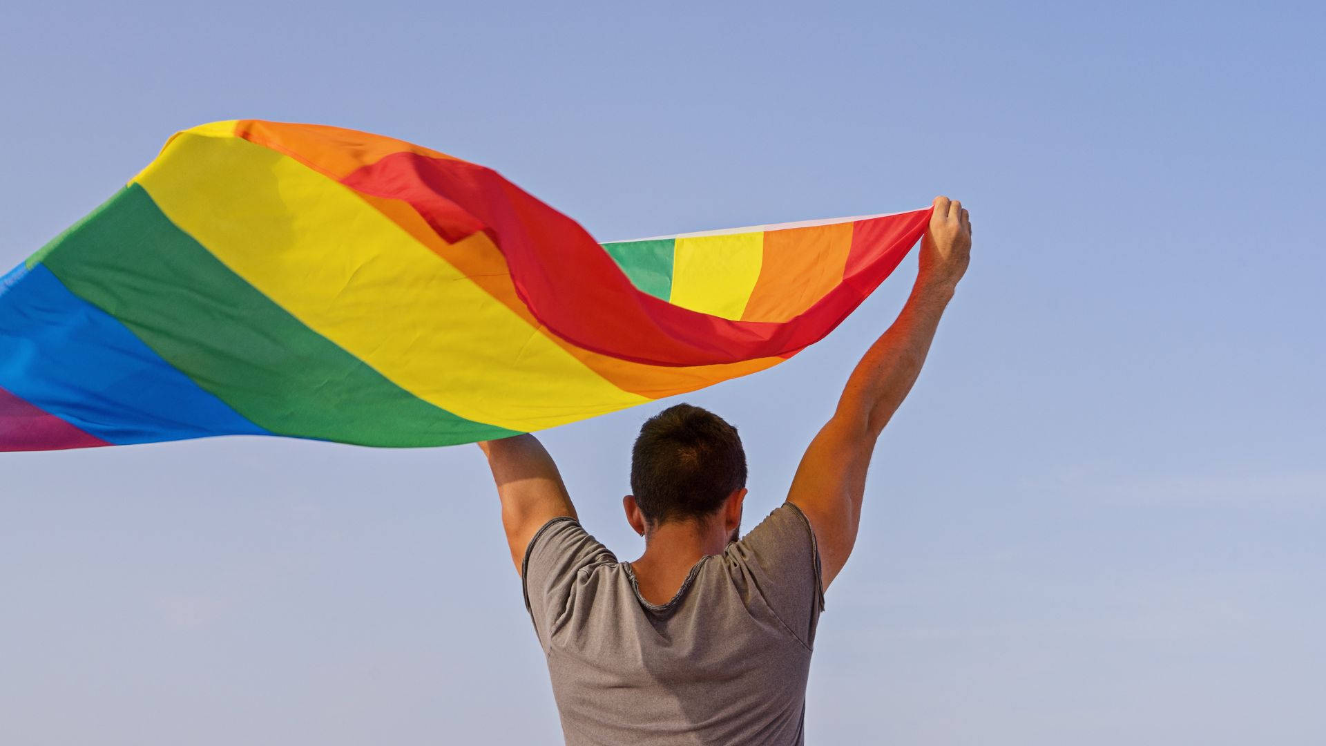 rainbow flag, clear blue sky, person, Full HD Desktop Wallpaper