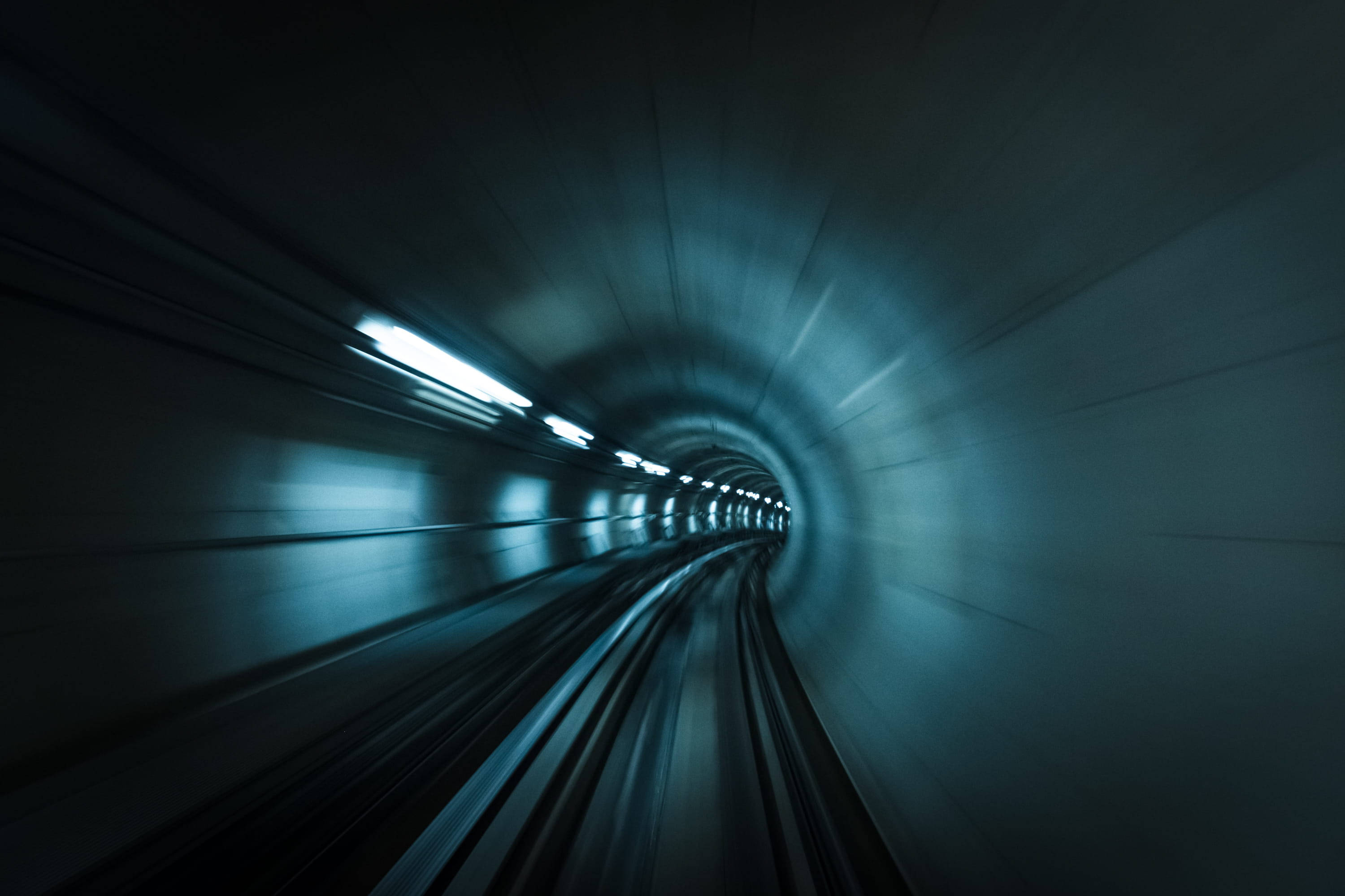 subway tunnel, dark blue-lit, streaking lights, 2K Desktop Wallpaper