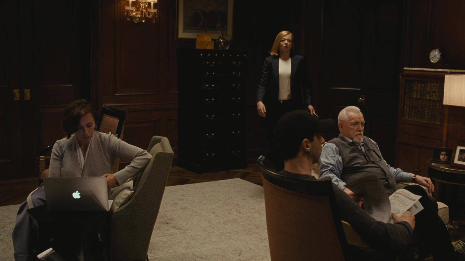 Succession, cast gathering, dimly lit wood-paneled room, Full HD Desktop Wallpaper