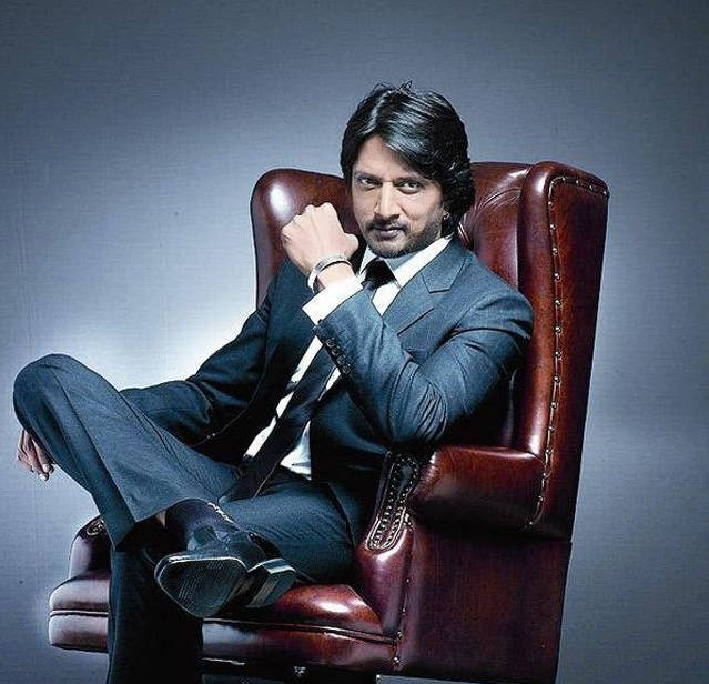 Sudeep, maroon chair, sharp suit, SD Desktop Wallpaper