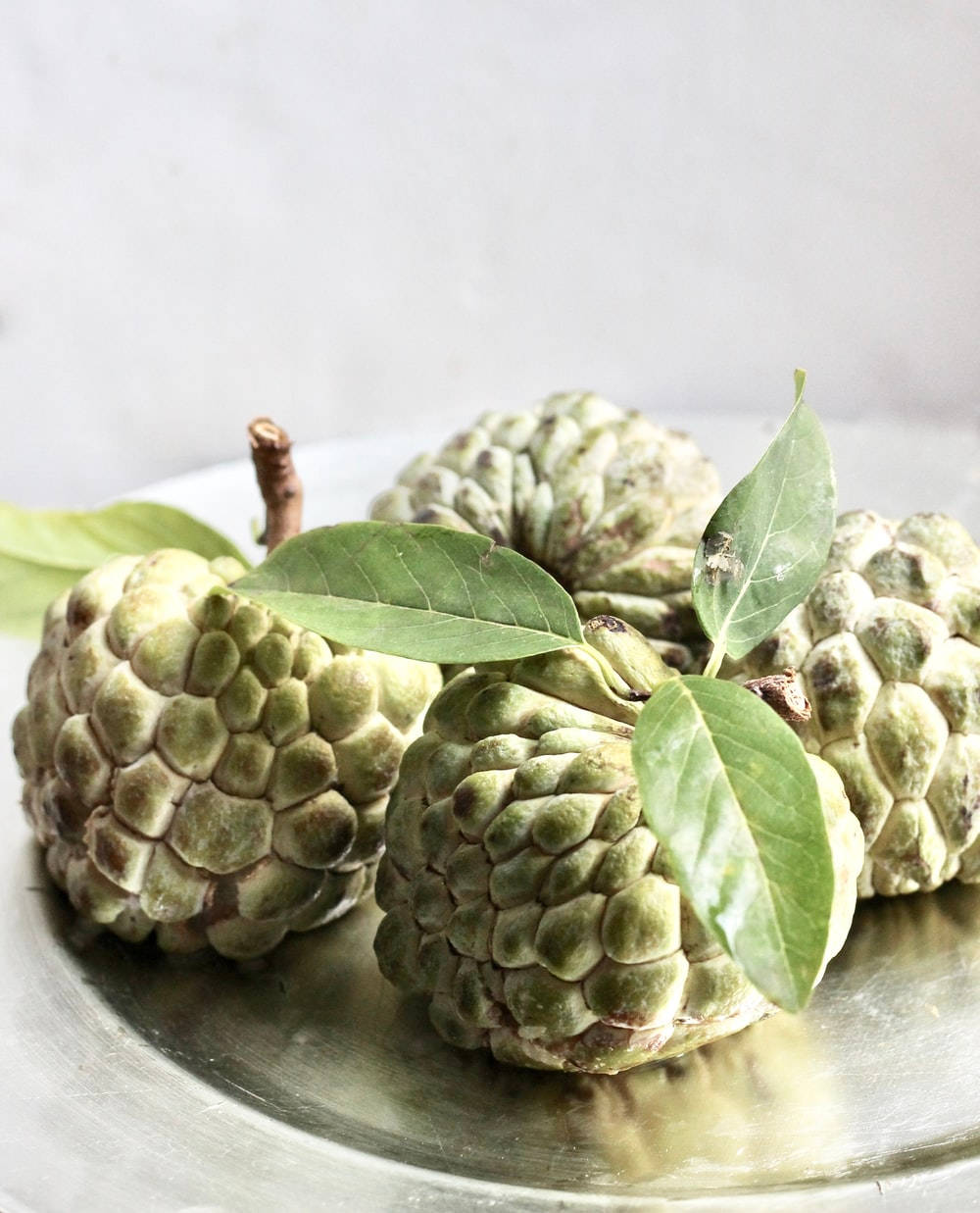 Sugar Apple, custard apples, reflective silver plate, SD Phone Wallpaper