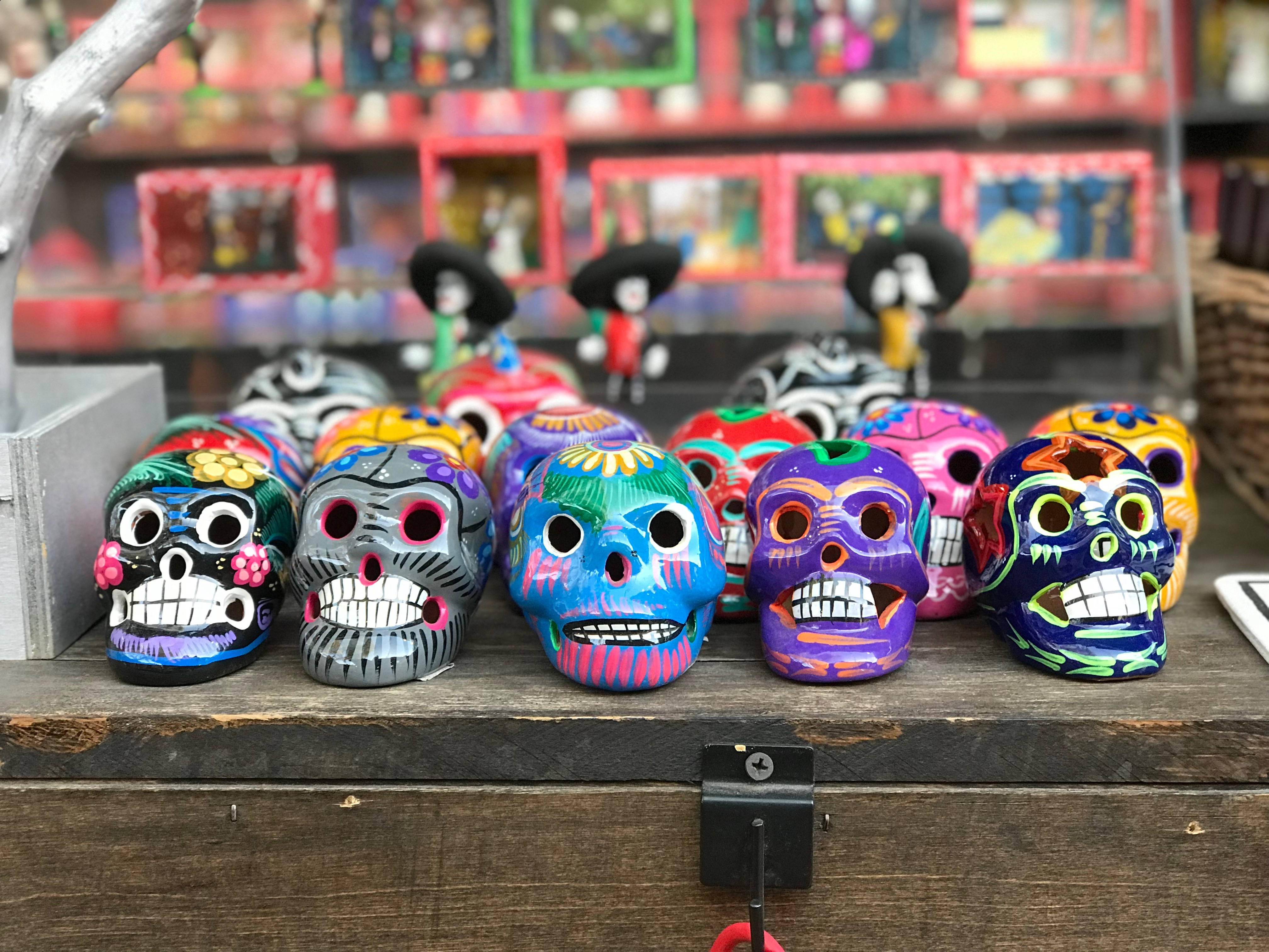 vibrant sugar skull artwork, bright colors, rustic wooden shelf, 4K Desktop Wallpaper