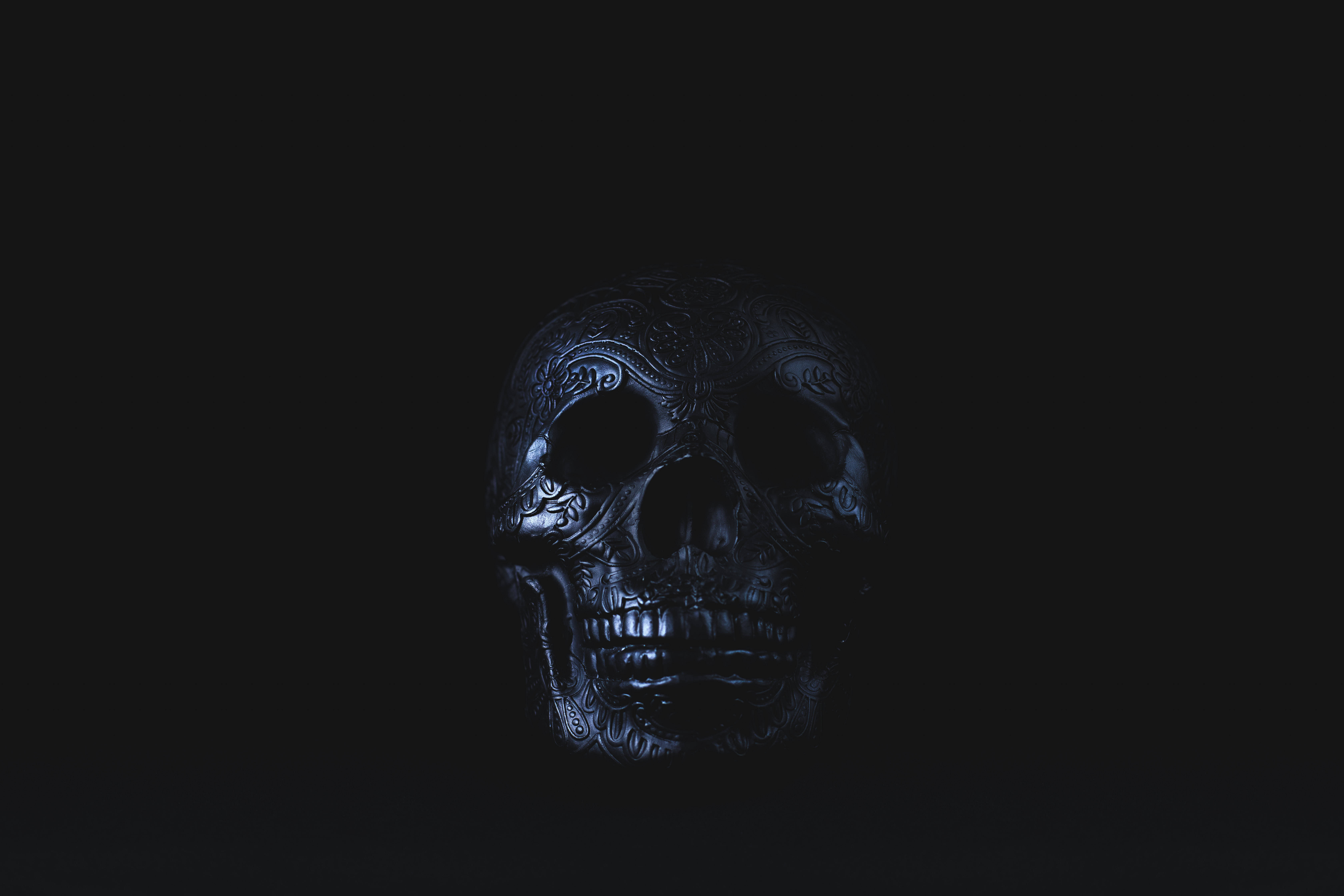 Spectacular Sugar Skull Art Design, glowing blue highlights, absolute darkness, 5K Desktop Wallpaper