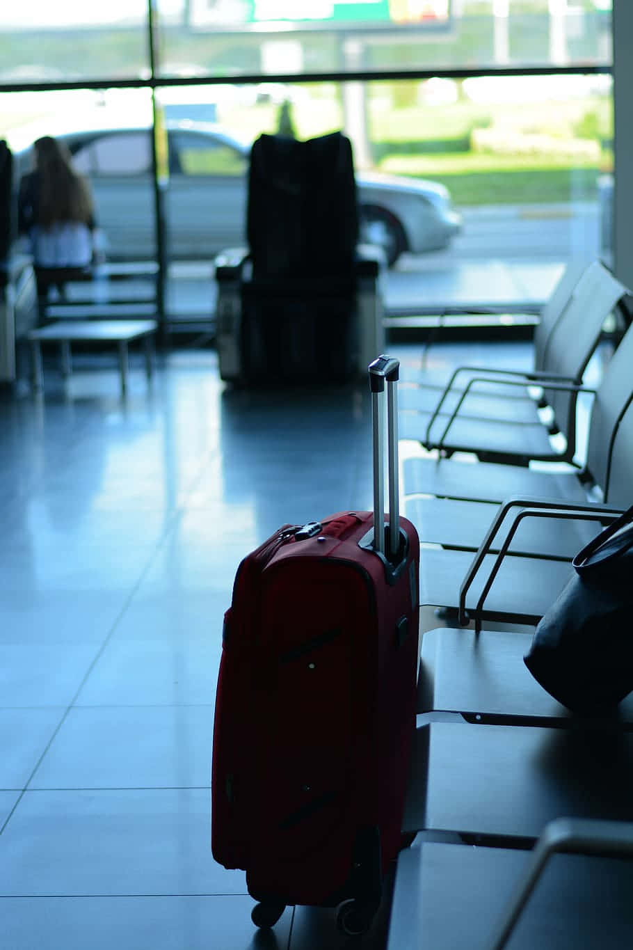 red suitcase, tiled floor, dimly lit airport terminal, HD Phone Wallpaper