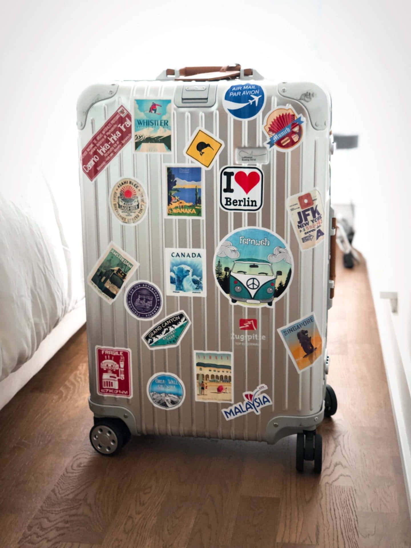 silver suitcase, colorful travel stickers, hardwood flooring, Full HD Phone Wallpaper