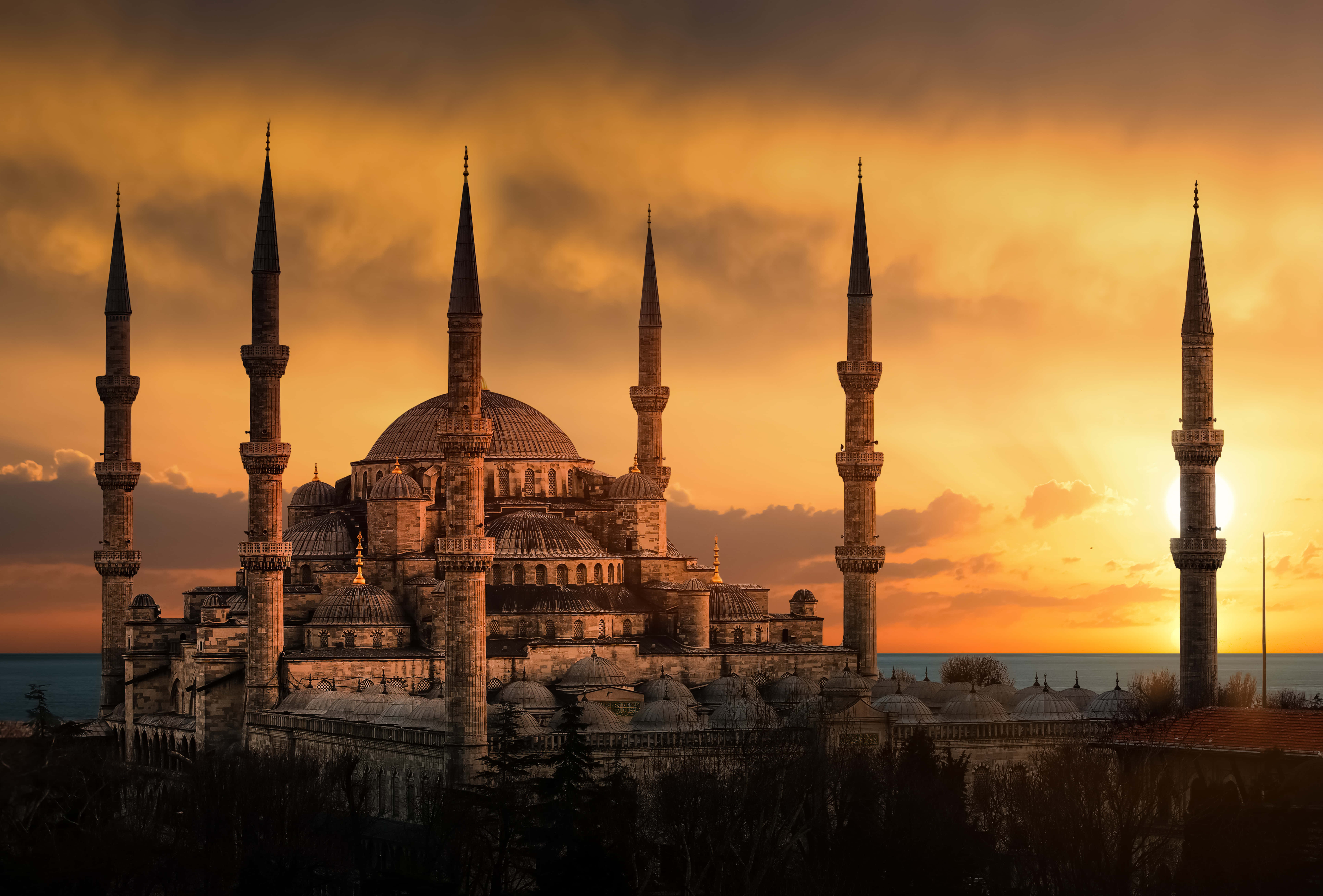 Sultan Ahmed Mosque, six minarets, fiery orange sunset sky, 8K Desktop Wallpaper