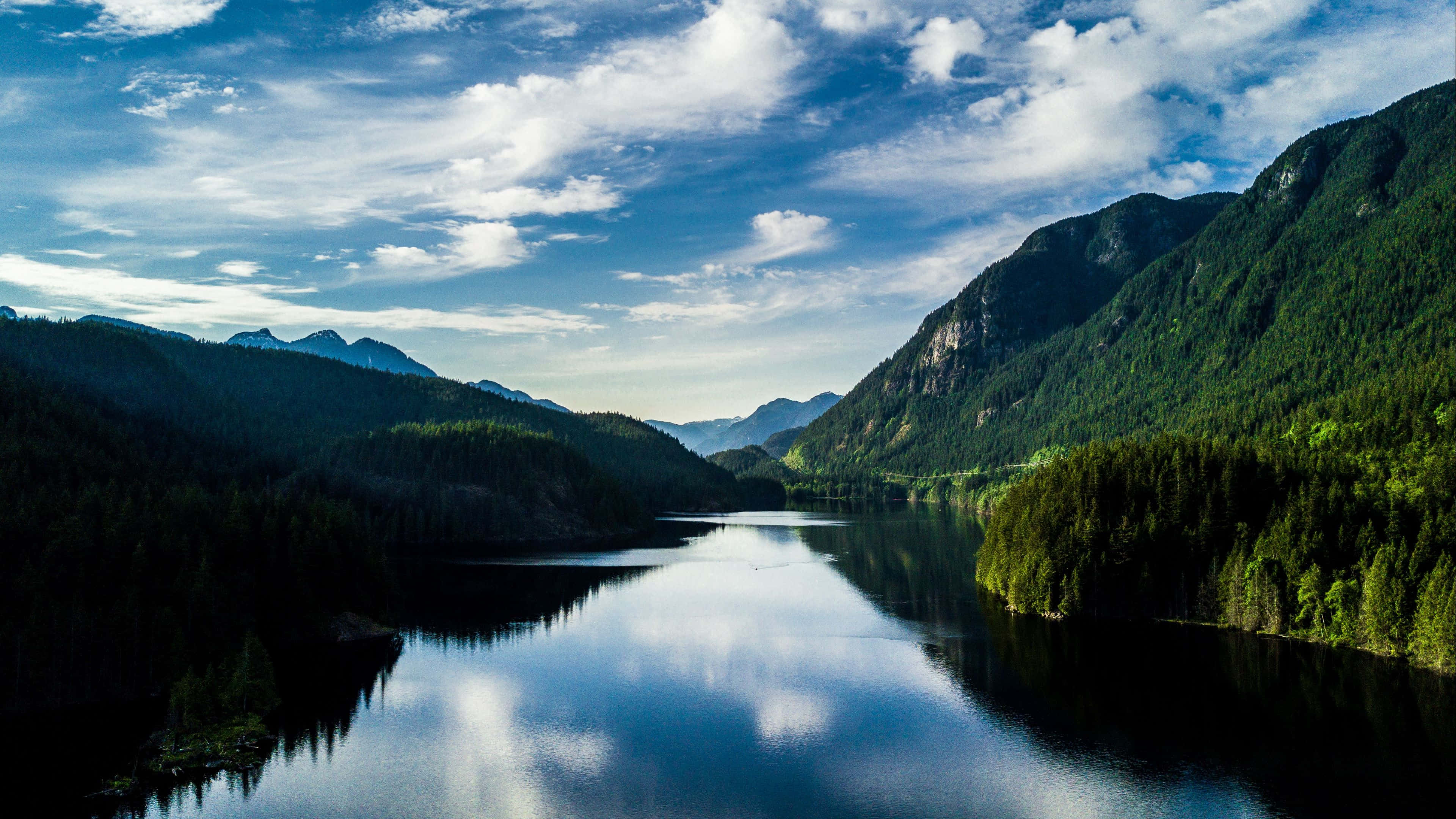 serene mountain lake, vibrant blue sky, fluffy white clouds, 4K Desktop Wallpaper