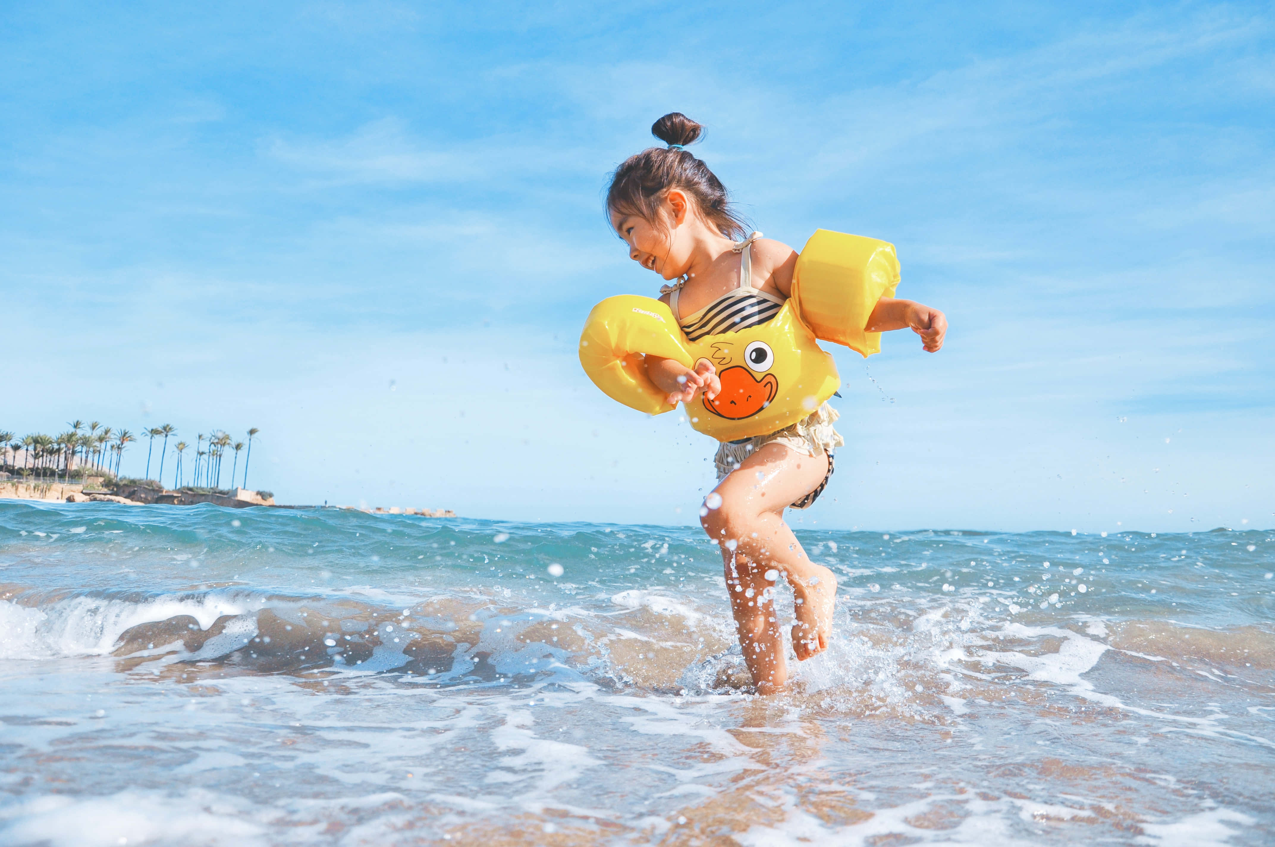 yellow duck floaties, ocean waves, clear blue sky, 4K Desktop Wallpaper