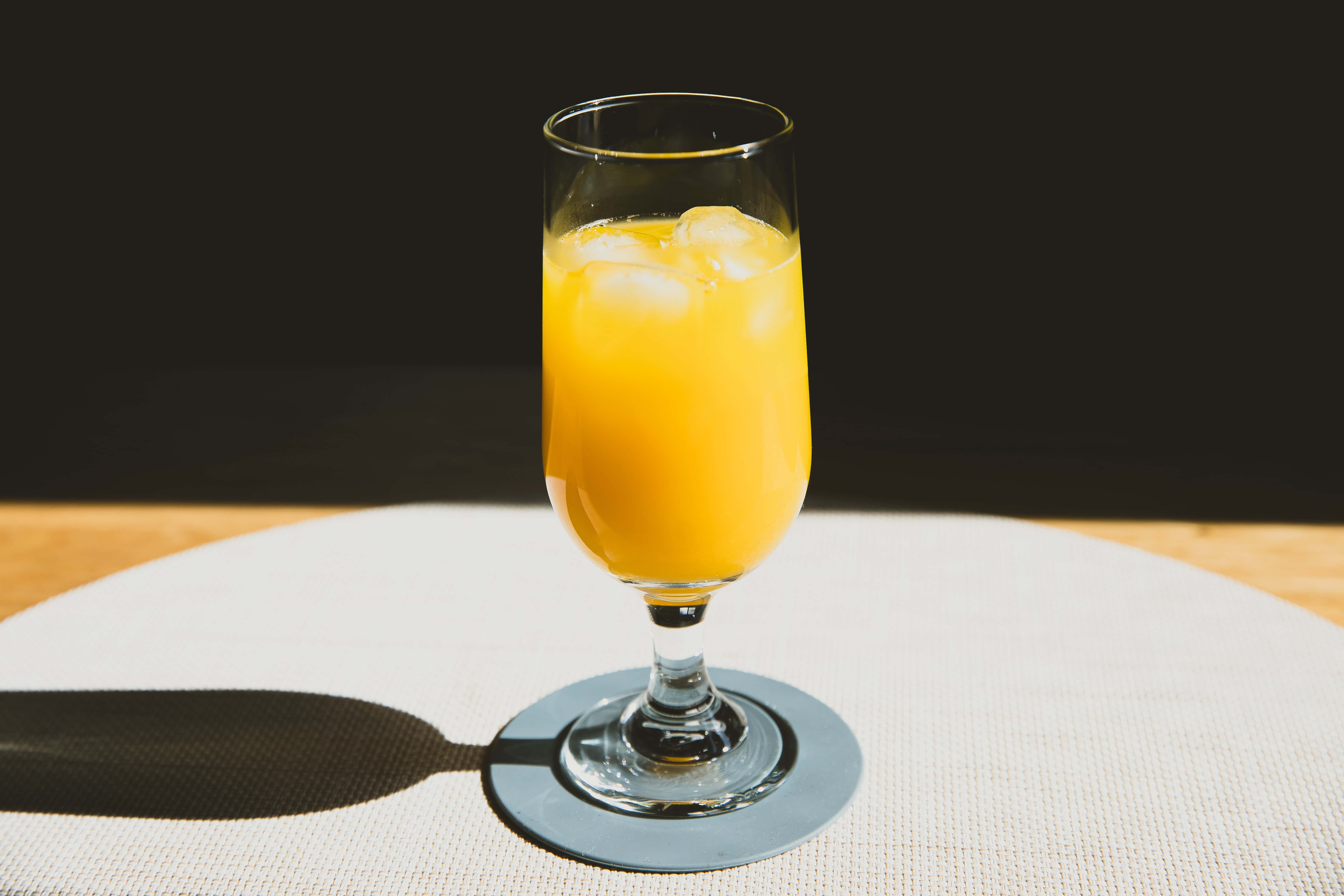 vibrant orange juice, tall glass, ice cubes, 5K Desktop Wallpaper