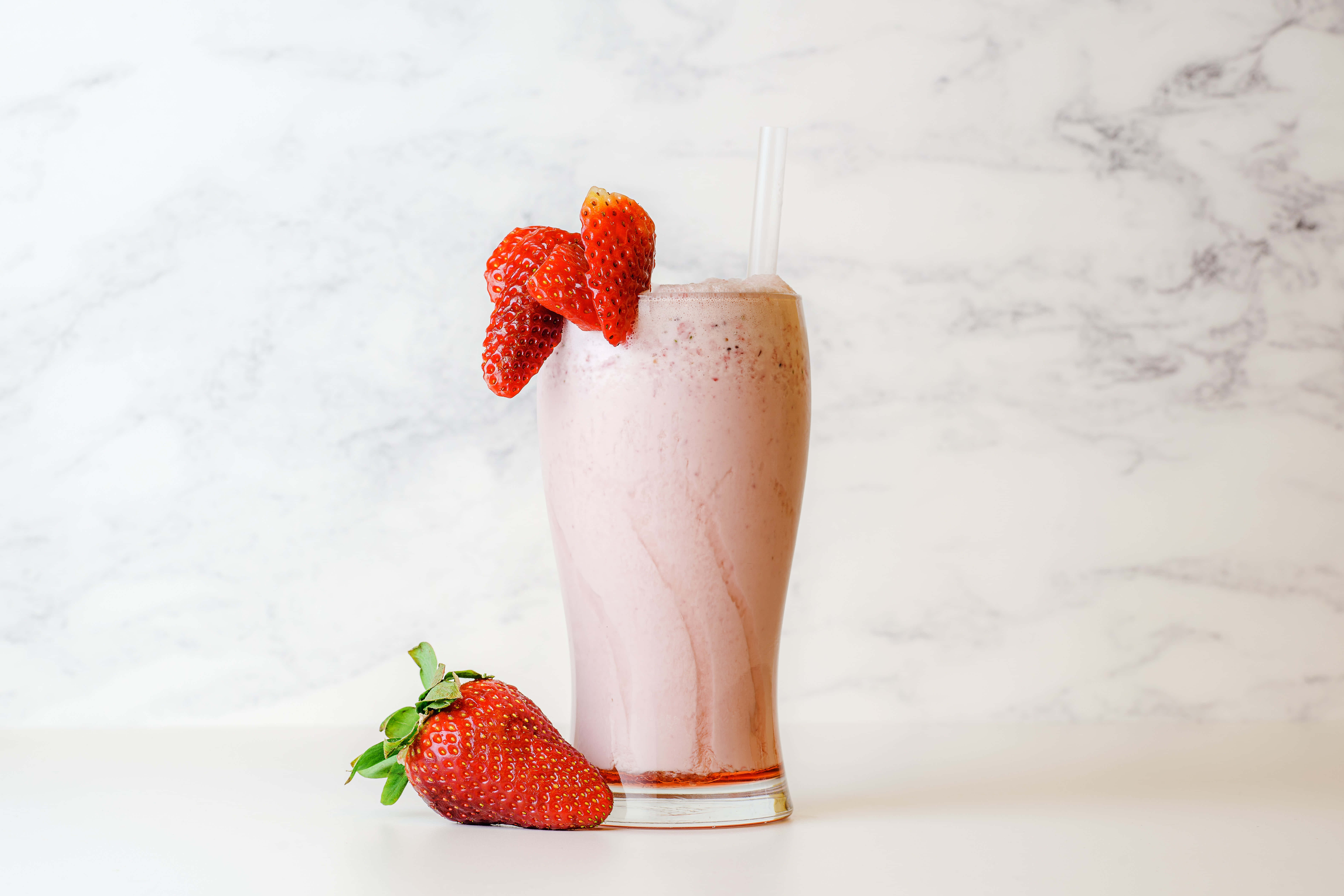 pink strawberry smoothie, fresh strawberries, white marble background, 5K Desktop Wallpaper