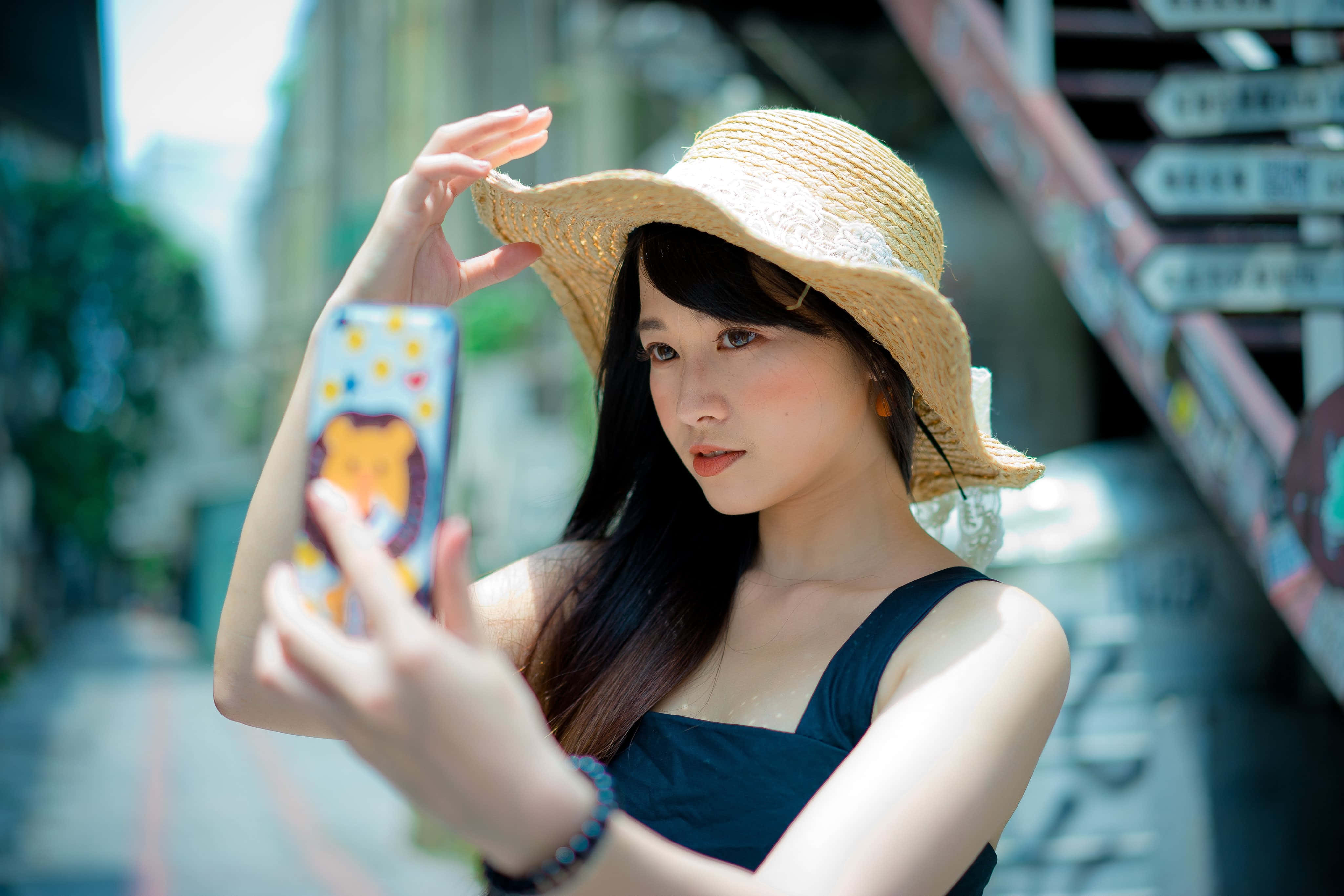 straw hat, colorful phone case, sunlit urban street, 4K Desktop Wallpaper
