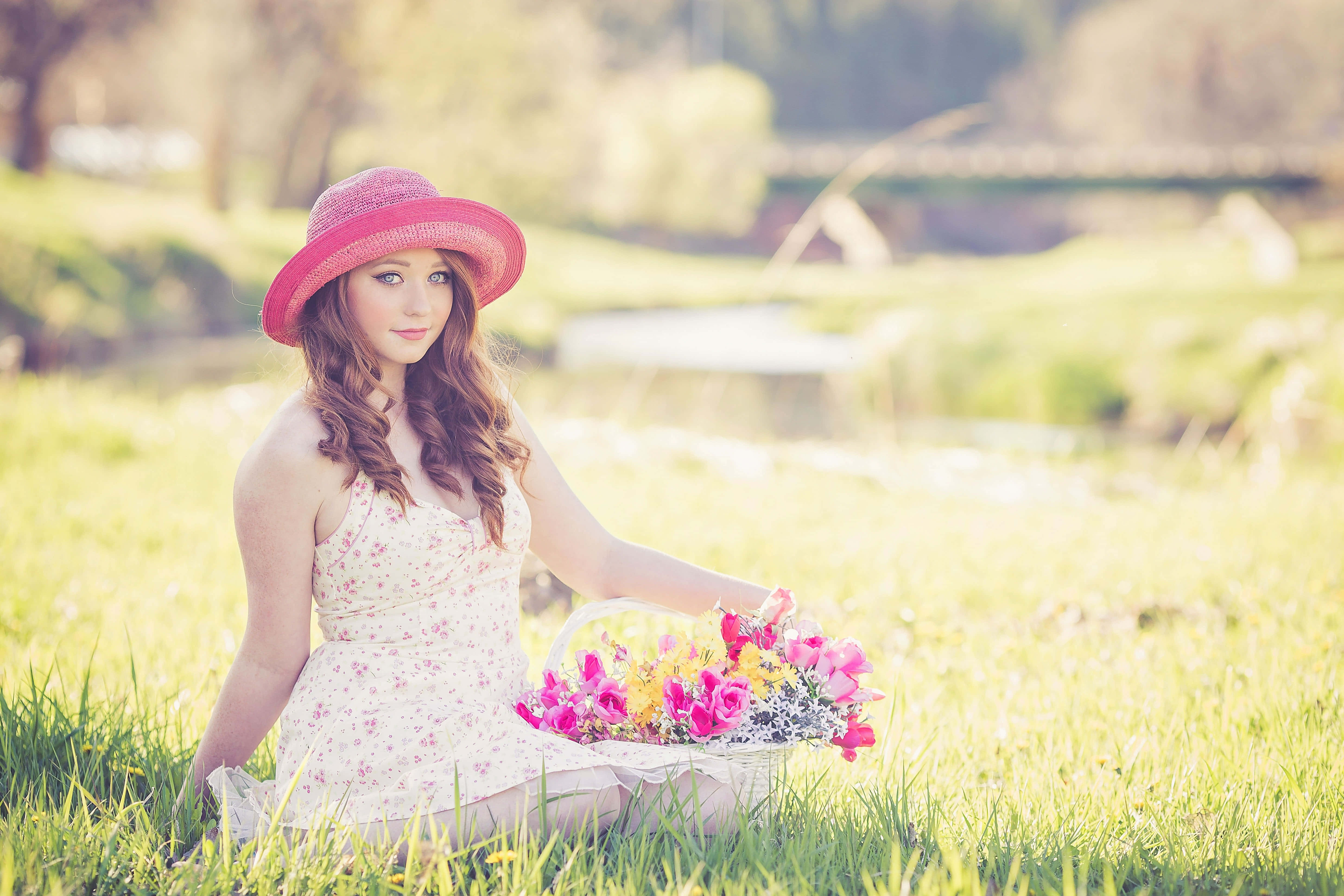 pink hat, sunlit meadow, basket of vibrant flowers, 5K Desktop Wallpaper