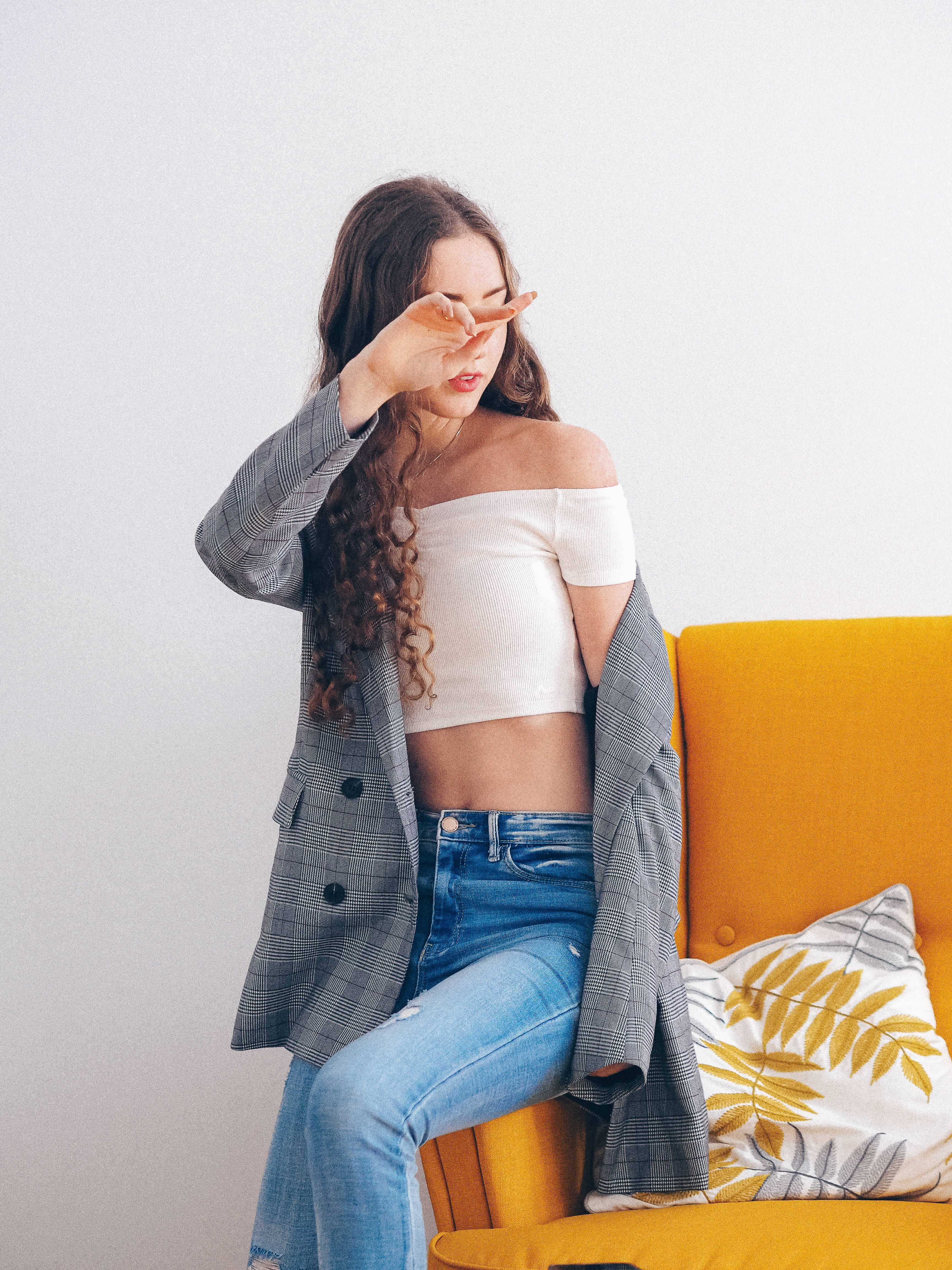 curly hair, bright yellow couch, plaid blazer, 4K Phone Wallpaper