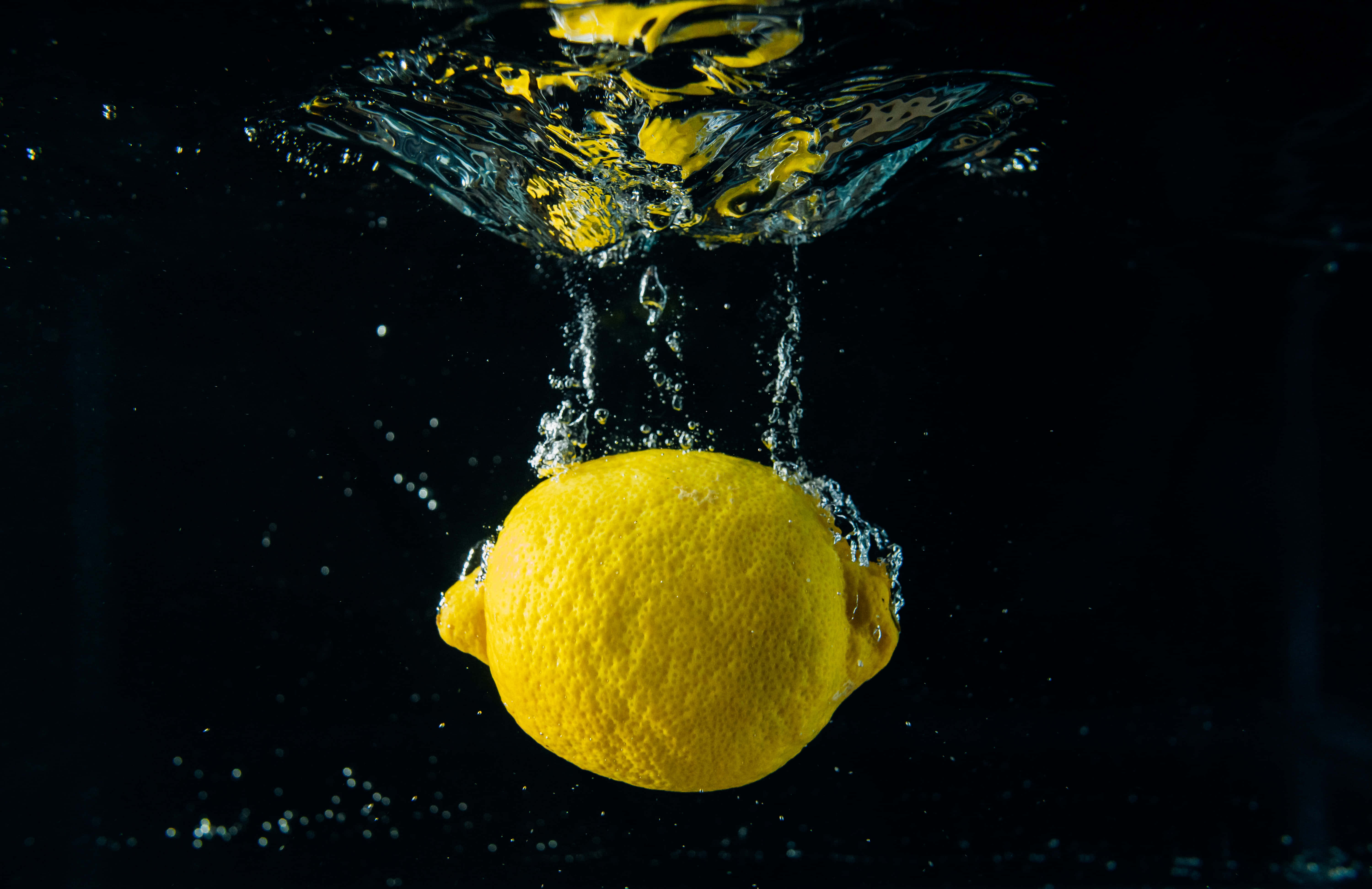 summer fruits, vibrant yellow lemon, dark water, 5K Desktop Wallpaper