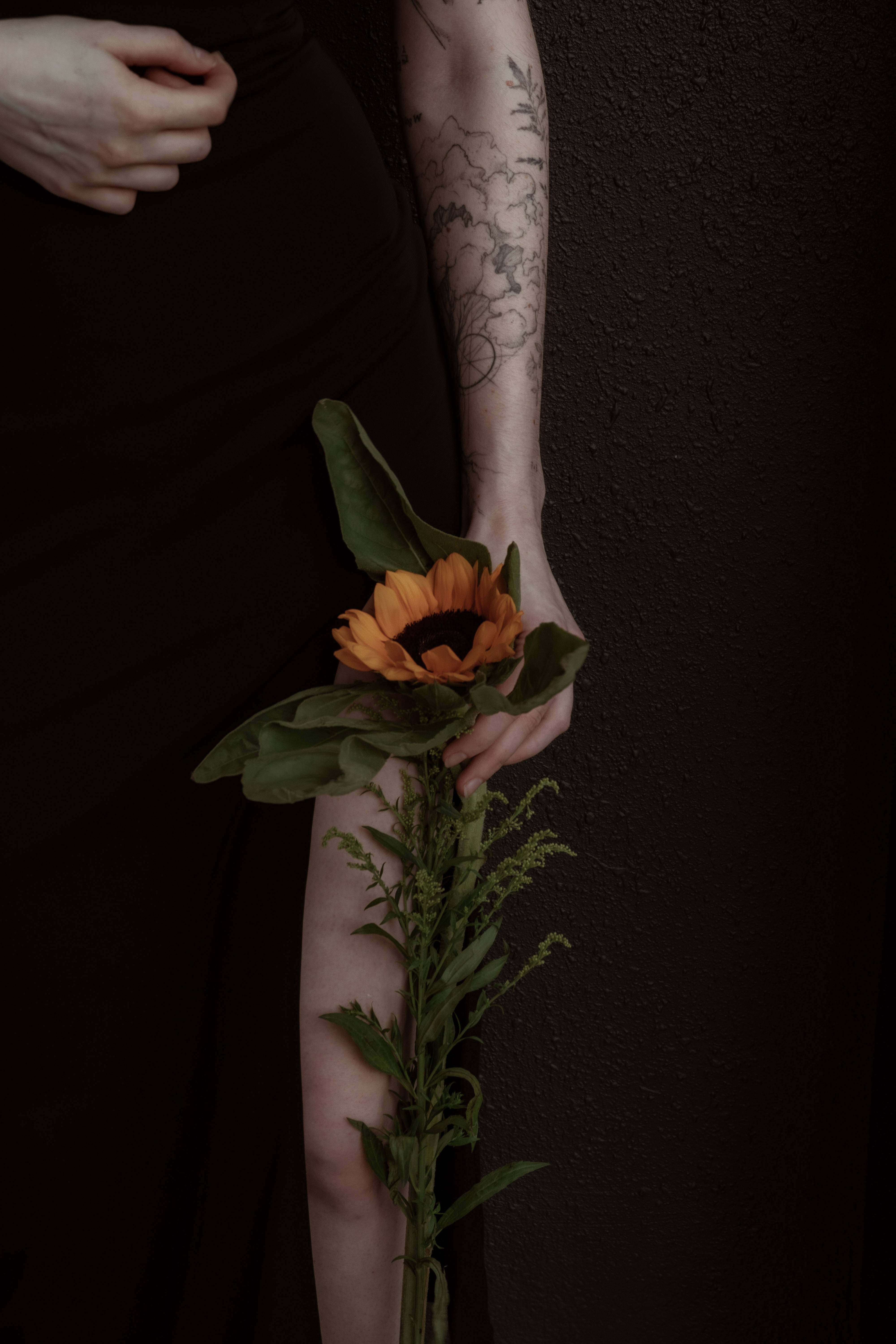 tattooed girl, sunflower aesthetic, dark textured wall, 5K Phone Wallpaper