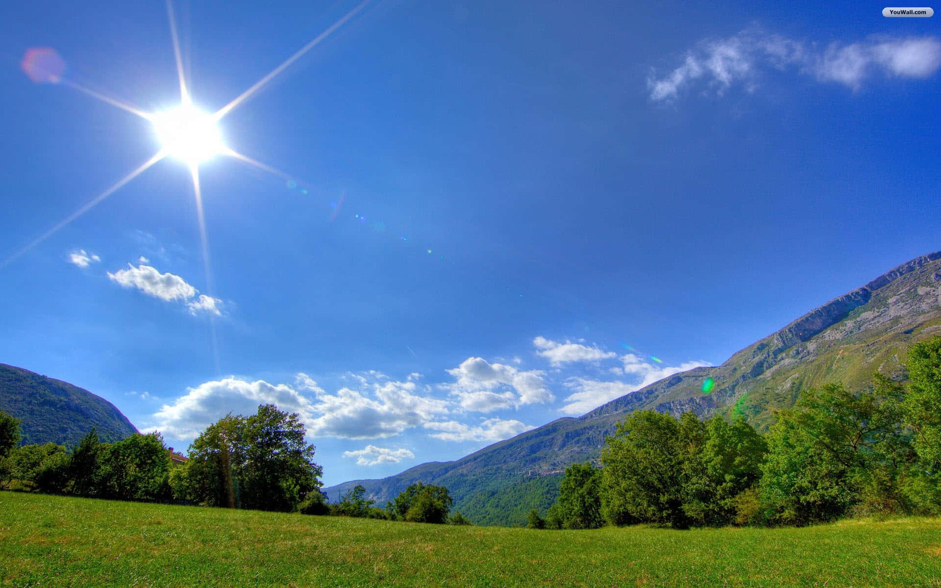 sunny mountain meadow landscape, starburst rays, lush green valley, Full HD Desktop Wallpaper