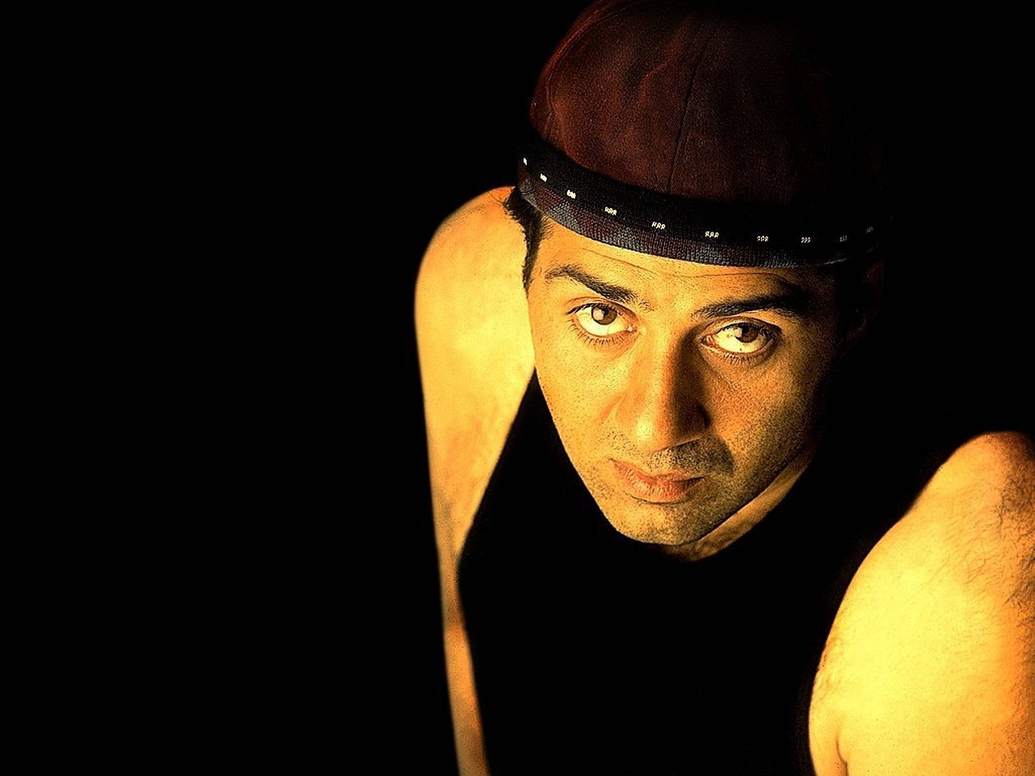 Sunny Deol, red cap, golden lighting, Full HD Desktop Wallpaper