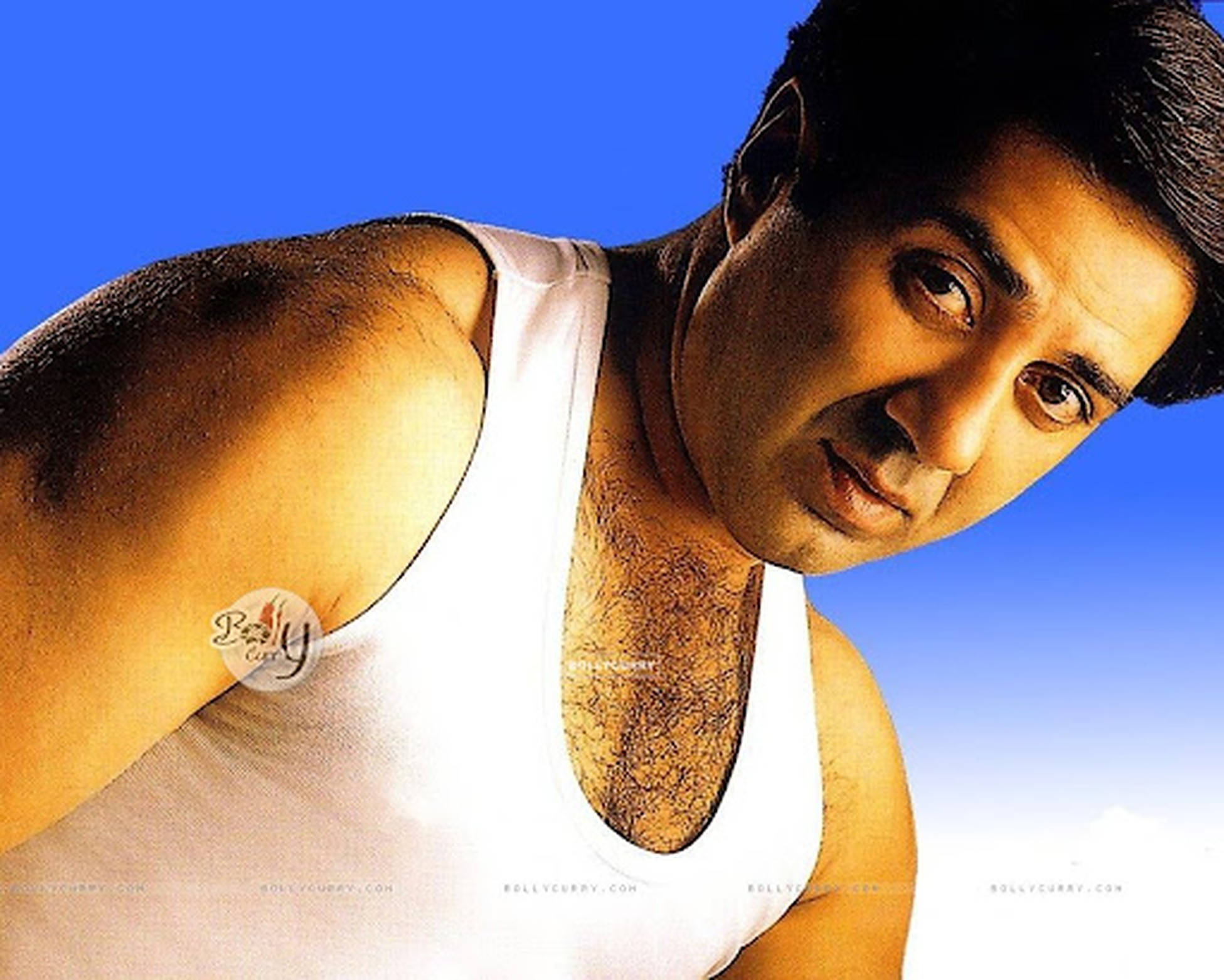Sunny Deol, white tank top, vibrant blue sky, Full HD Desktop Wallpaper