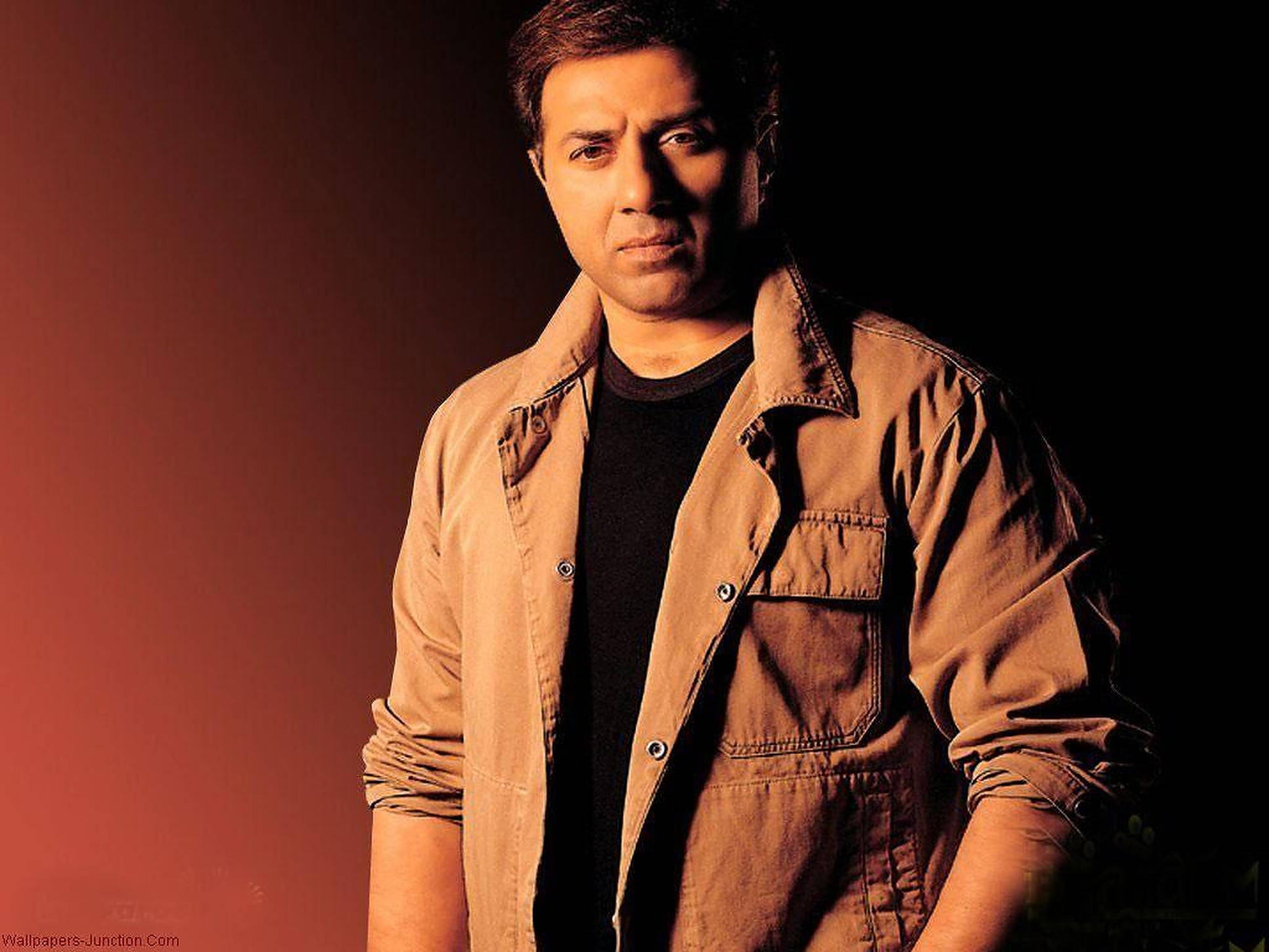 Sunny Deol, tan jacket, gradient red and black background, Full HD Desktop Wallpaper