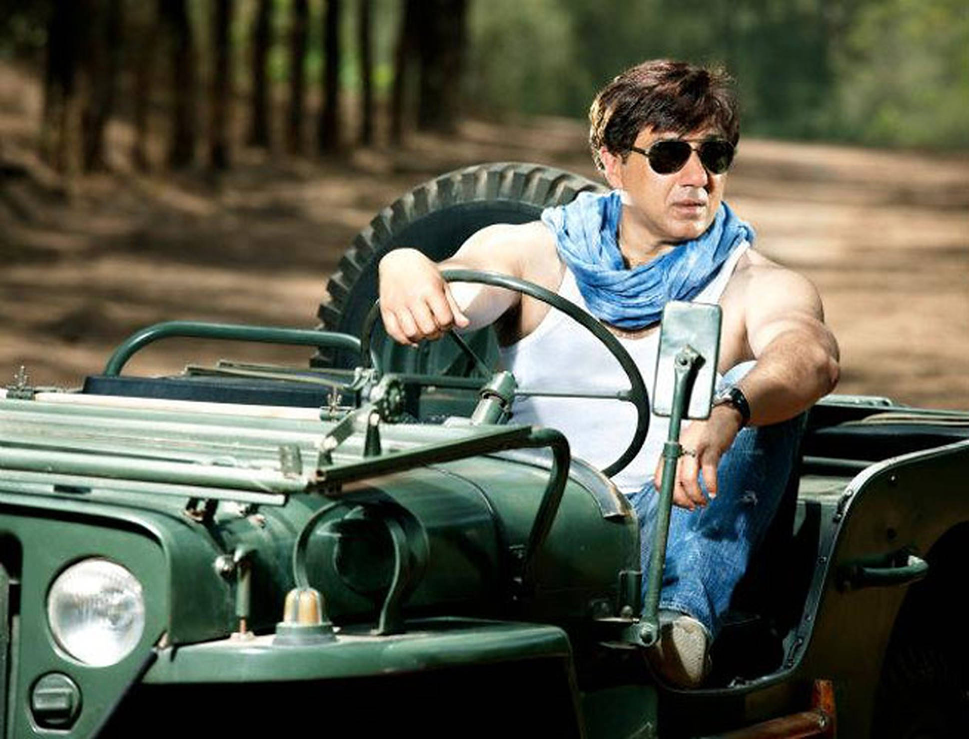 Sunny Deol, green jeep, sunlit forest trail, Full HD Desktop Wallpaper