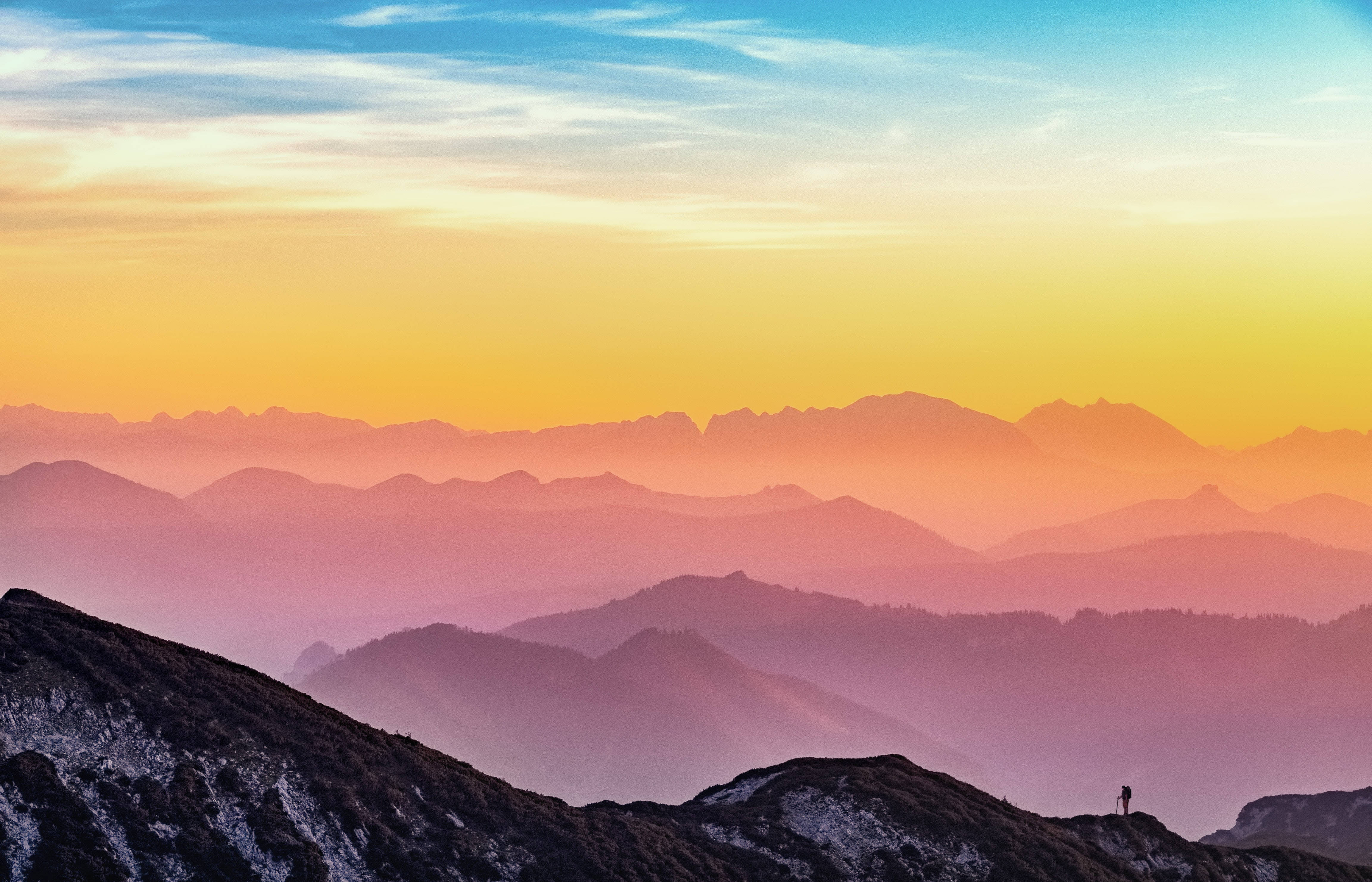 mountain ridge, sunrise, warm orange and pink hues, 4K Desktop Wallpaper