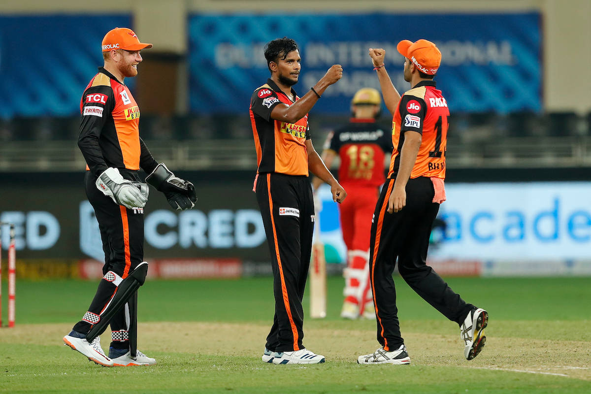 Sunrisers Hyderabad, orange and black uniforms, green field, SD Desktop Wallpaper