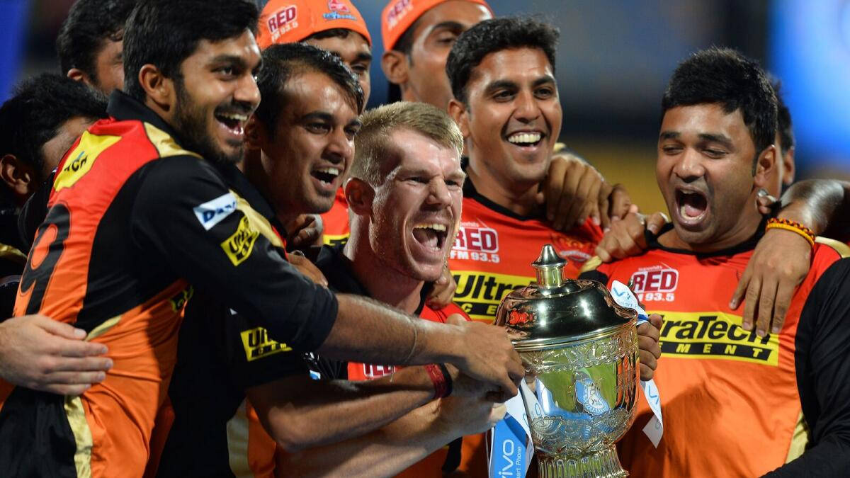 Sunrisers Hyderabad, orange jerseys, gleaming silver trophy, SD Desktop Wallpaper