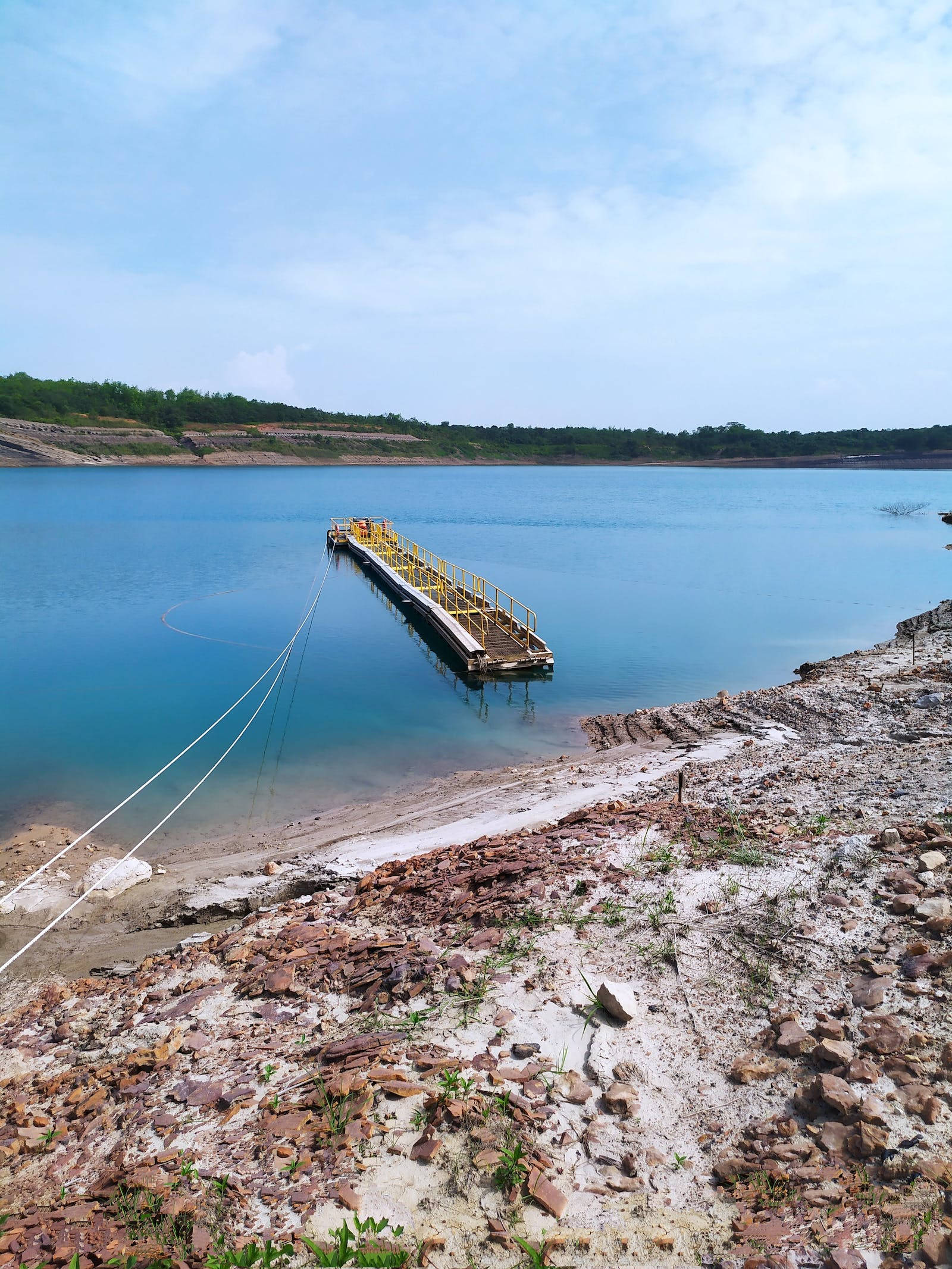 yellow dock, turquoise water, rocky shoreline, Full HD Phone Wallpaper