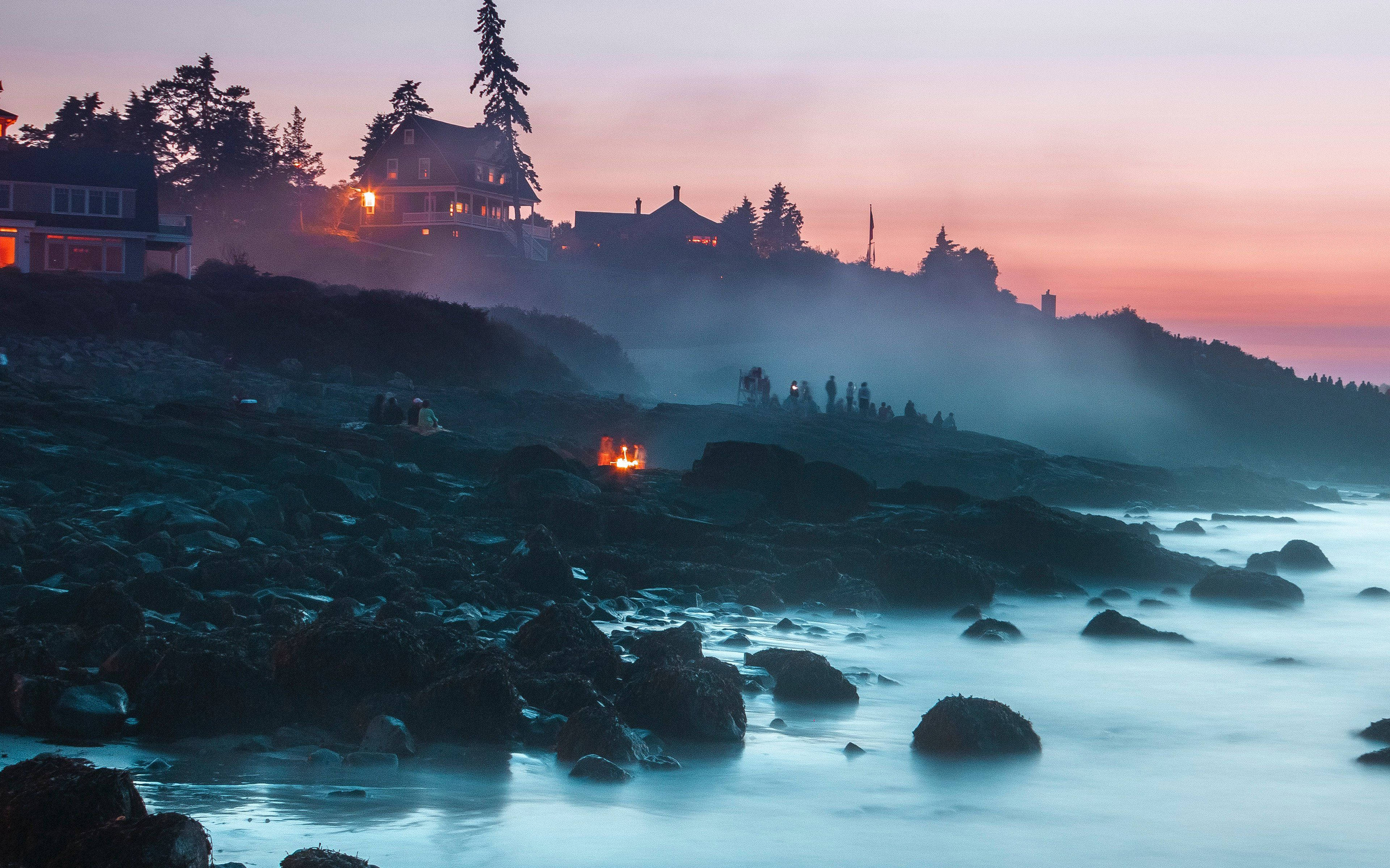 Sunset Aesthetic By The Sea, misty coastal twilight, glowing house lights, 4K Desktop Wallpaper