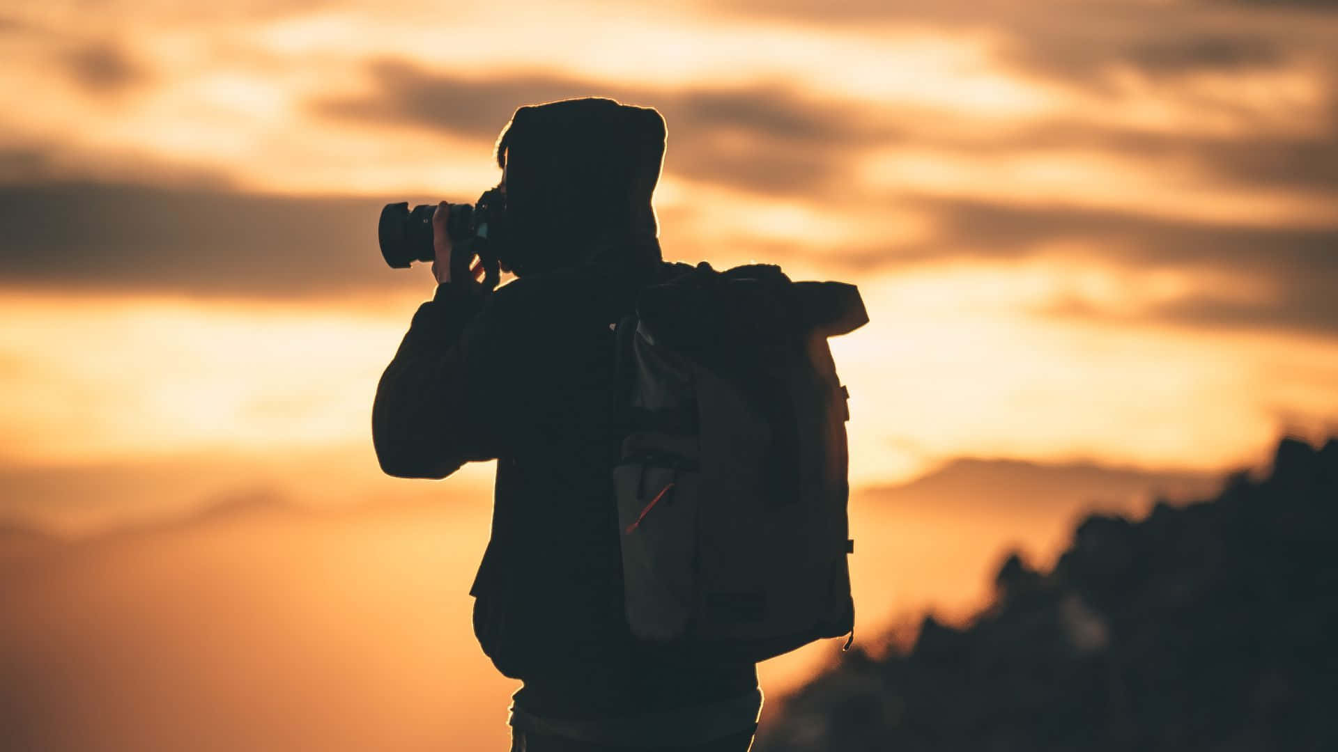 silhouette cameraman, sunset, warm orange clouds, Full HD Desktop Wallpaper