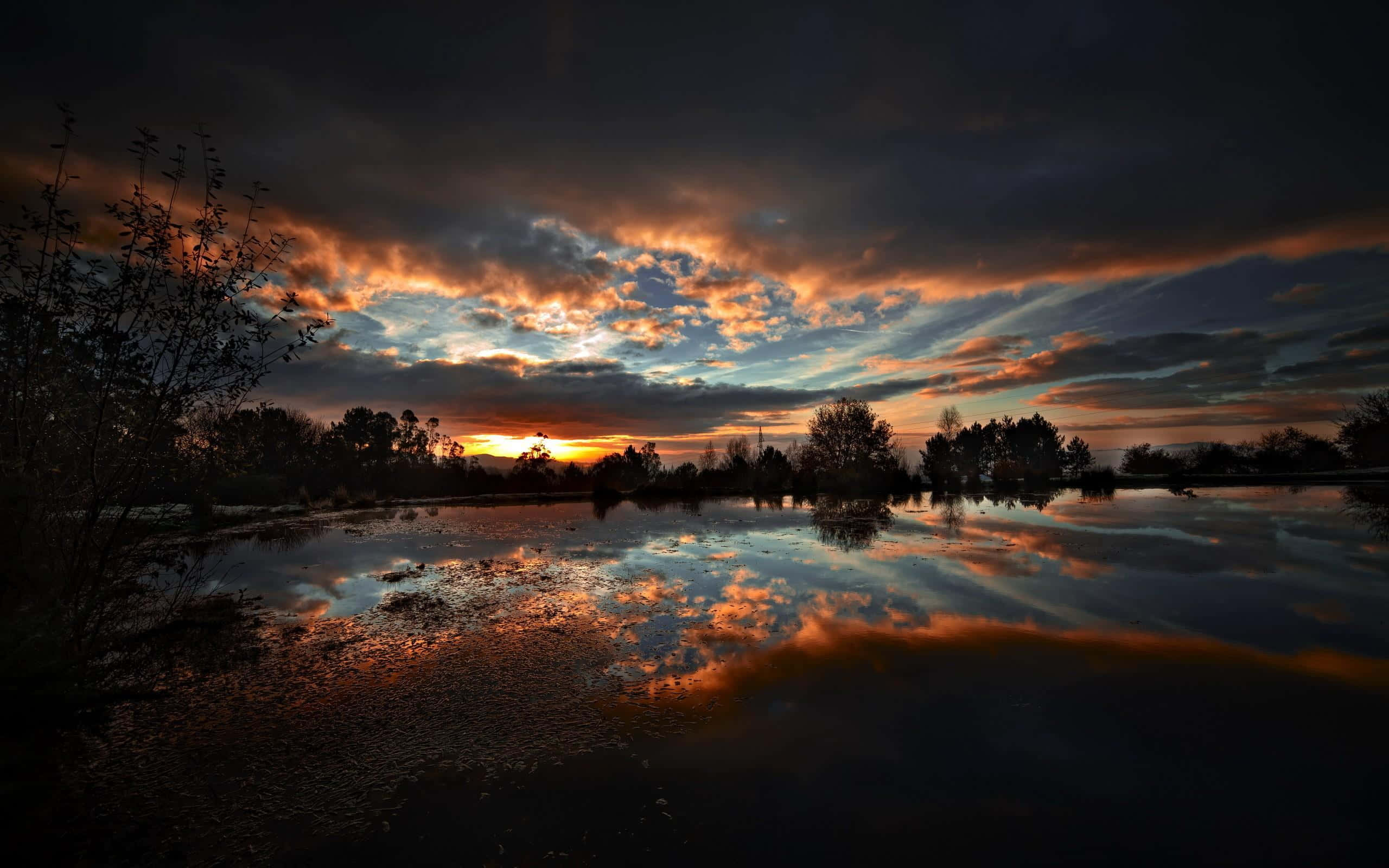 Sunset Reflection, calm, dark pond, fiery orange and deep blue clouds, 2K Desktop Wallpaper