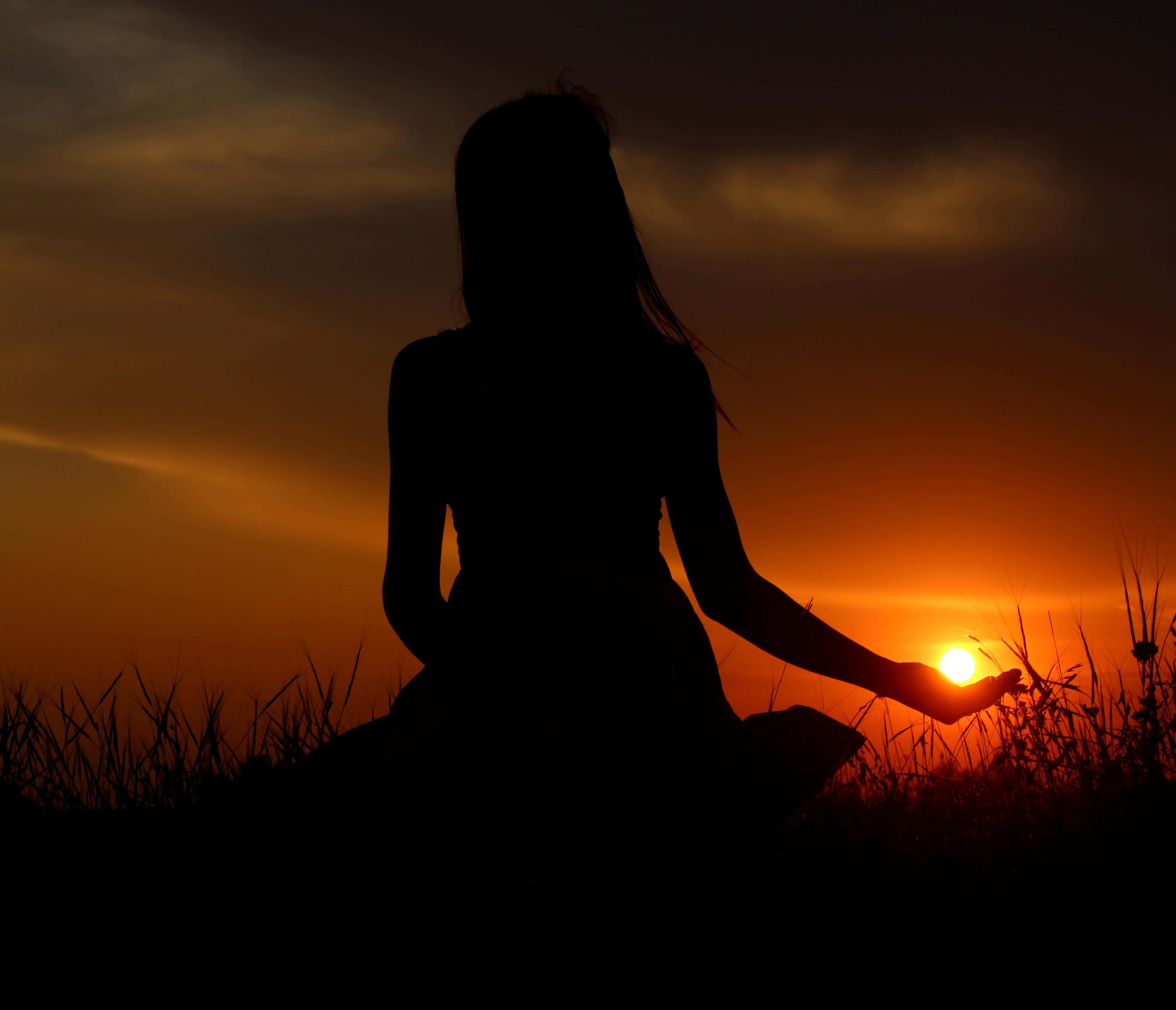 sunset silhouette, person meditating, grass, 4K Desktop Wallpaper