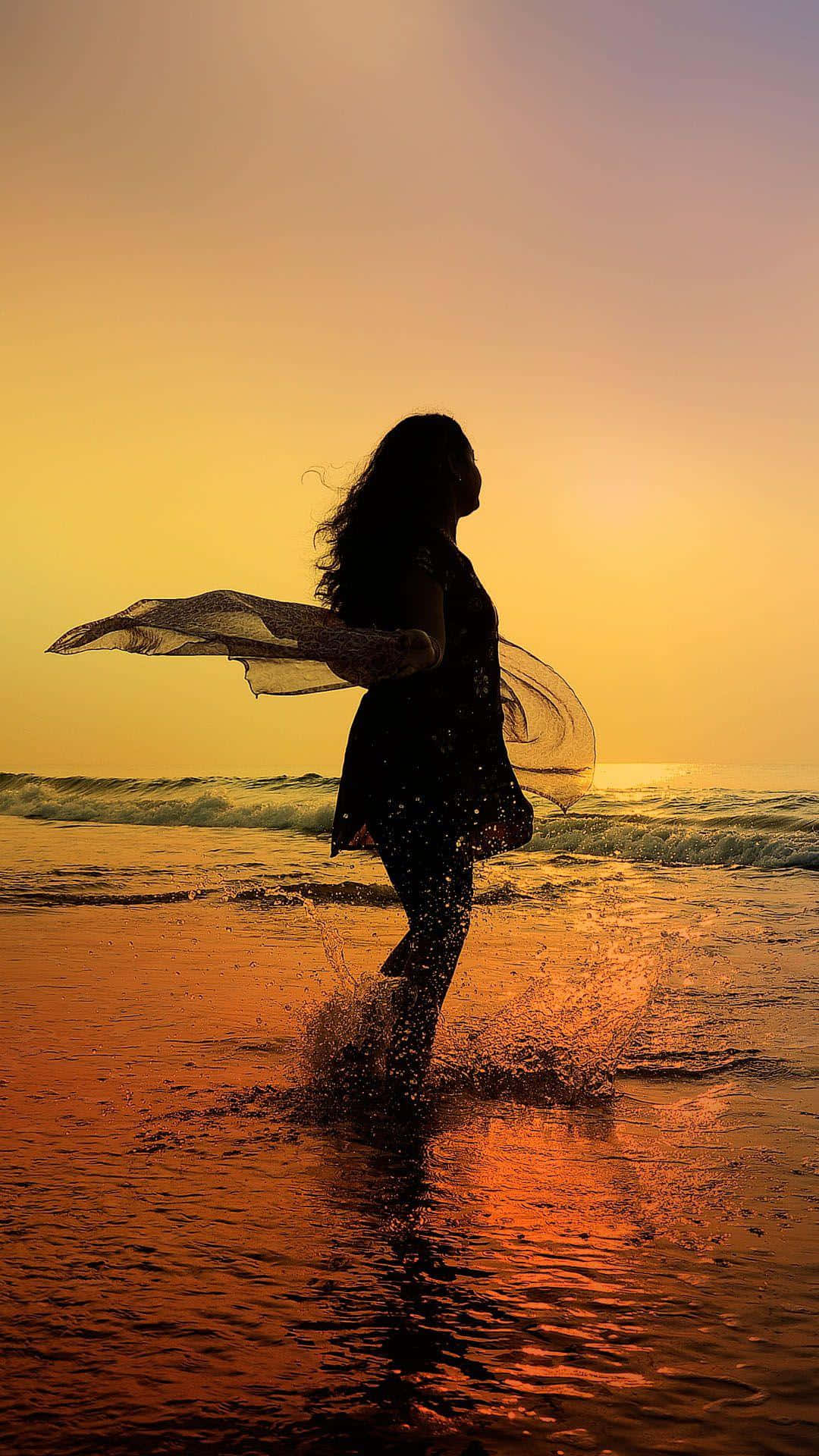 Sunset Silhouette, woman's silhouette, shallow ocean water, Full HD Phone Wallpaper