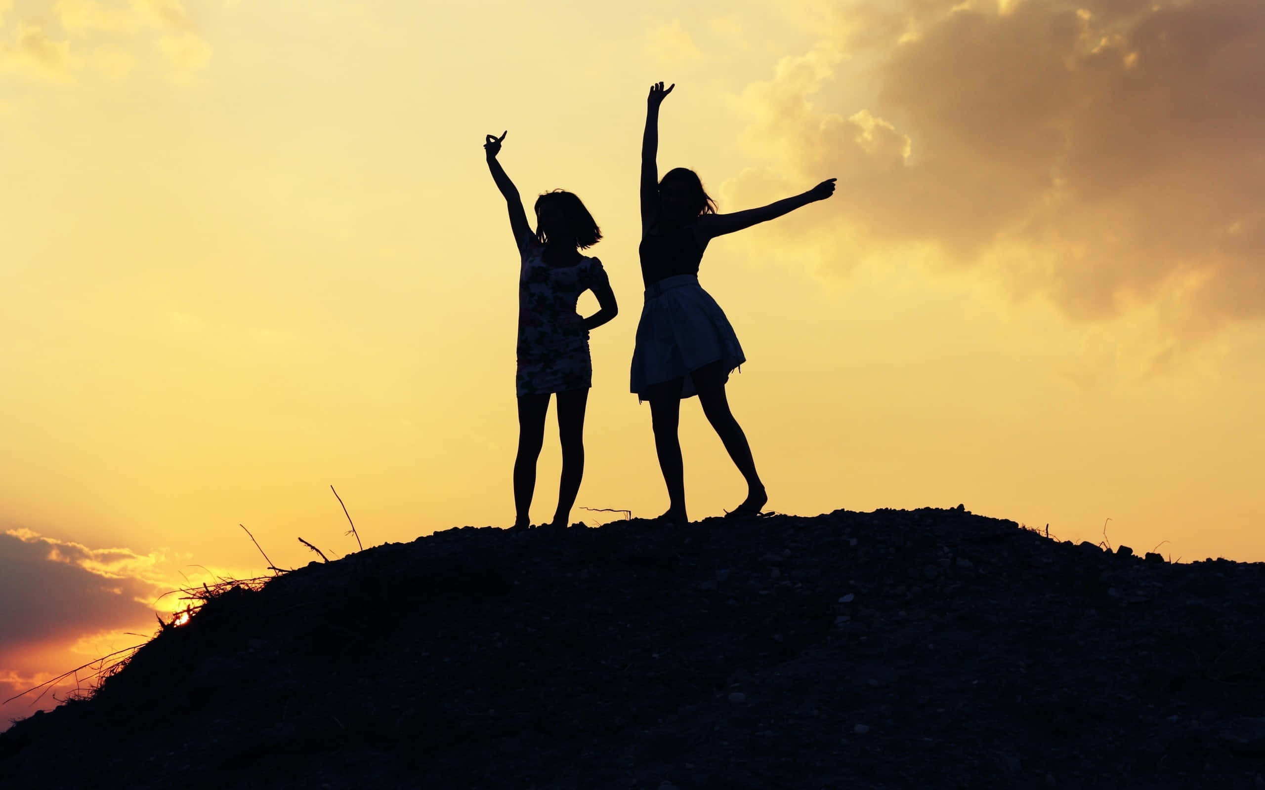two friendly girls, silhouetted girls, golden sunset clouds, 2K Desktop Wallpaper