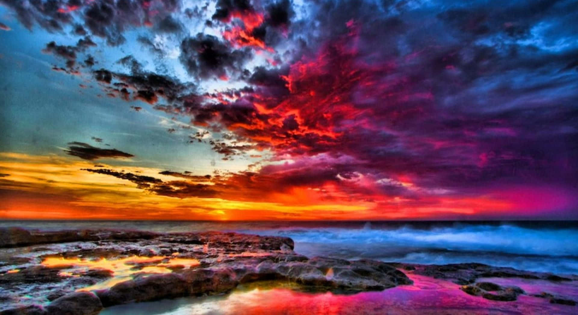 colorful sunset, fiery reds purples and oranges, rocky shoreline, Full HD Desktop Wallpaper